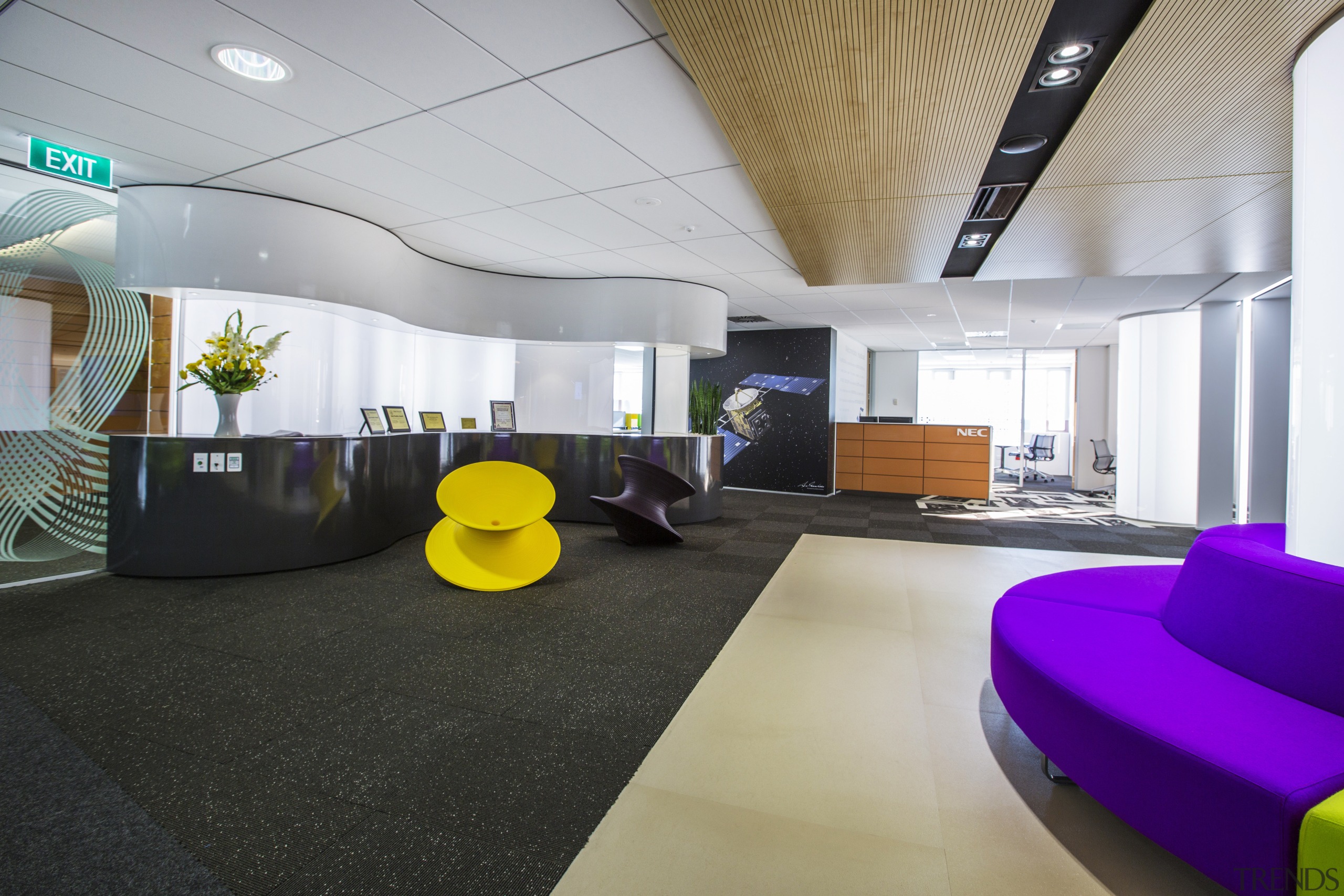 A ribbon of cabinetry wraps around one wall architecture, ceiling, interior design, lobby, office, real estate, gray, black