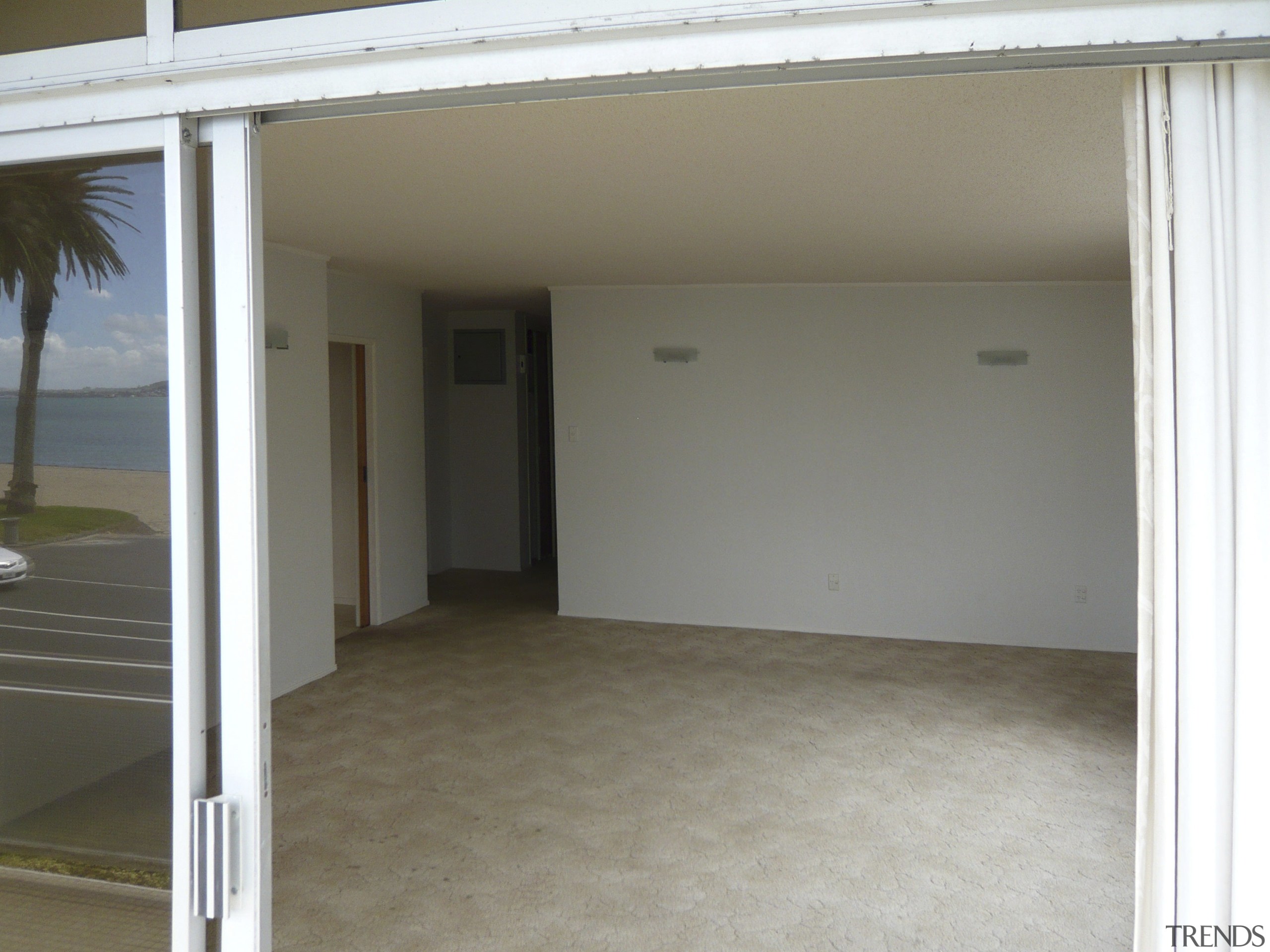 image of the lounge prior to renovations. - floor, flooring, home, house, property, real estate, wall, window, gray