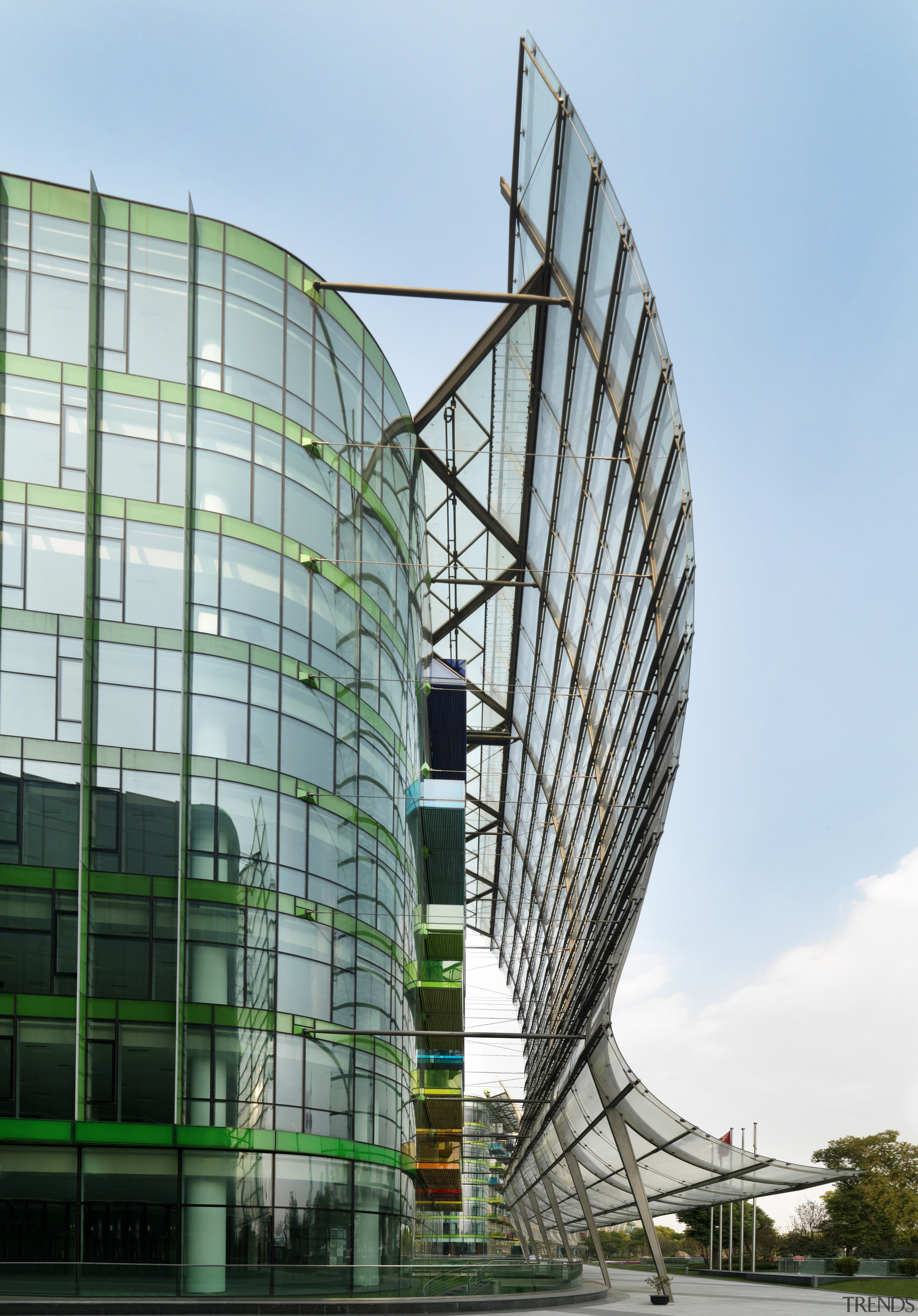 View of the Shanghai International Cruise Terminal. architecture, building, corporate headquarters, daytime, facade, headquarters, metropolis, mixed use, sky, skyscraper, structure, tourist attraction, tower block, white