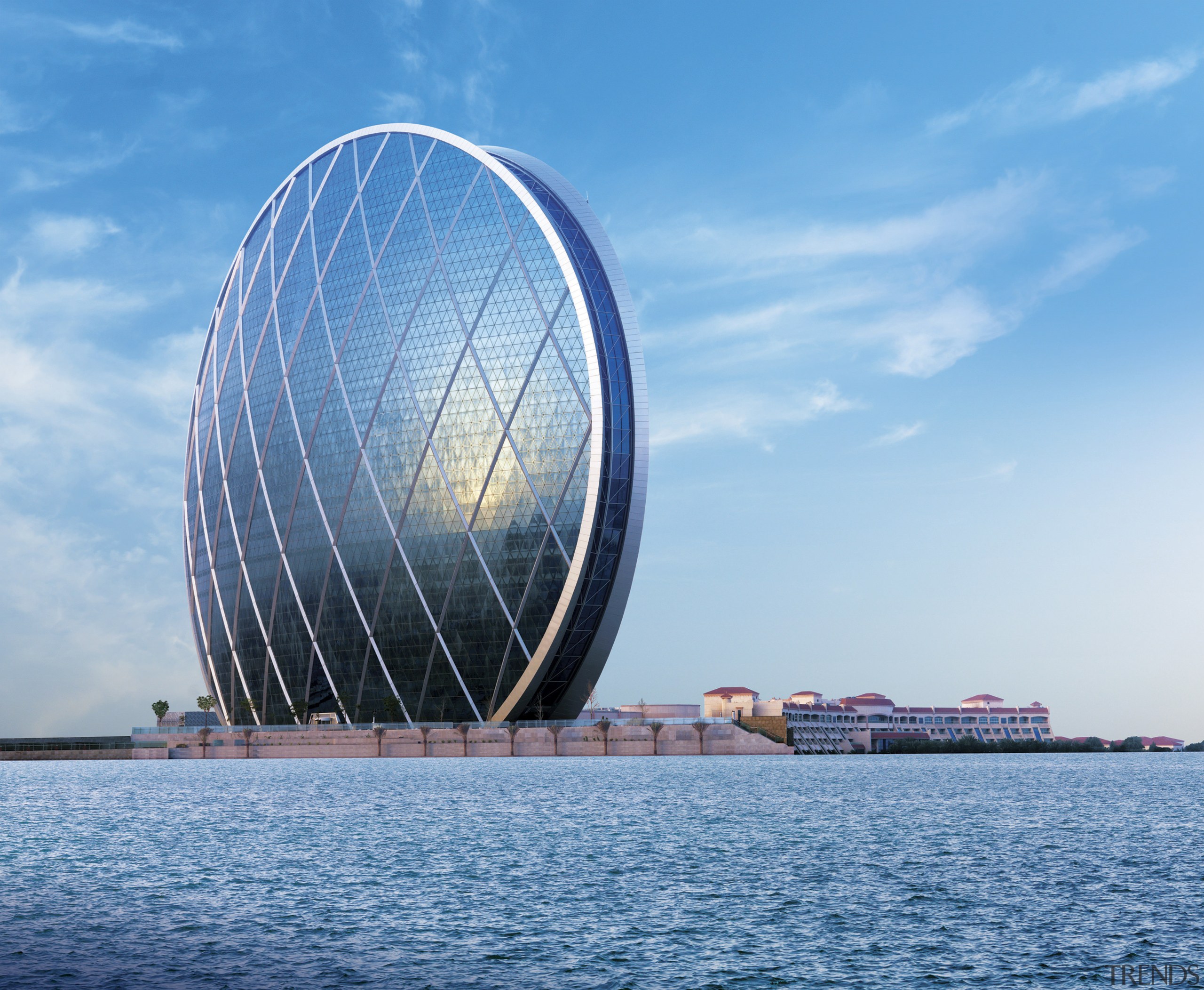 Here is a view of the headquarters of architecture, building, cloud, daytime, horizon, landmark, reflection, sea, sky, skyscraper, vacation, water, teal