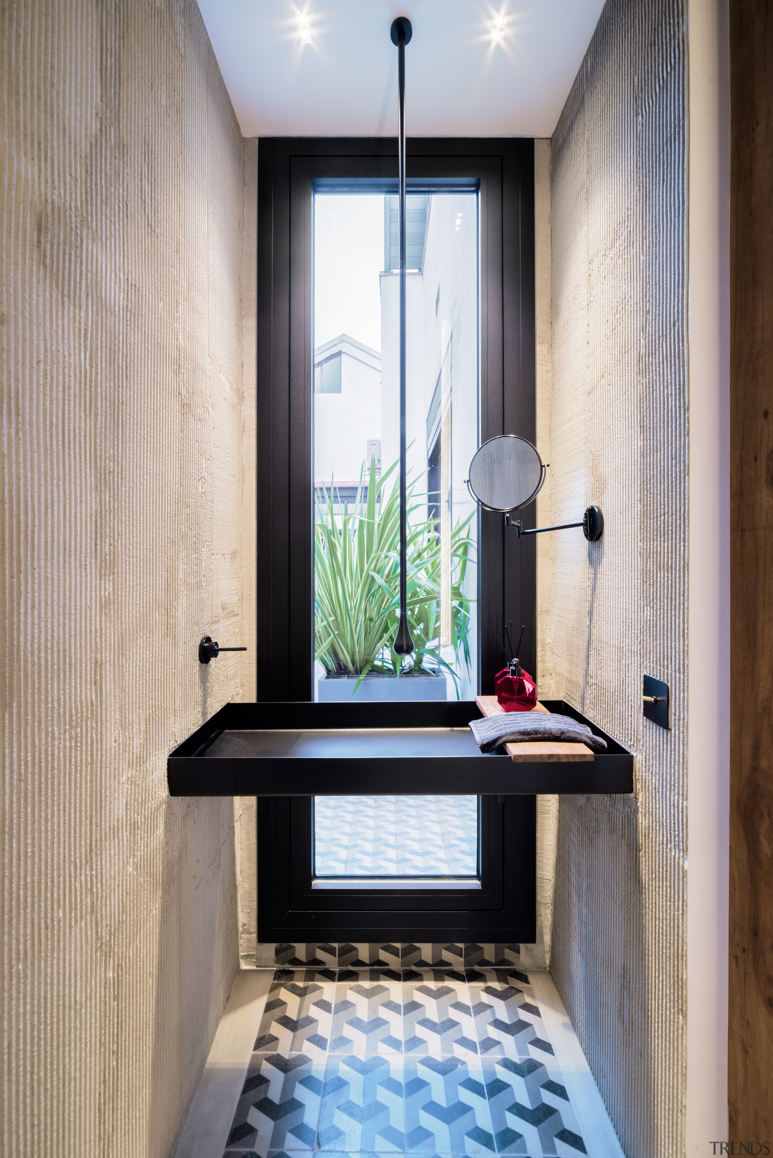 In the powder room, a custom sink made 