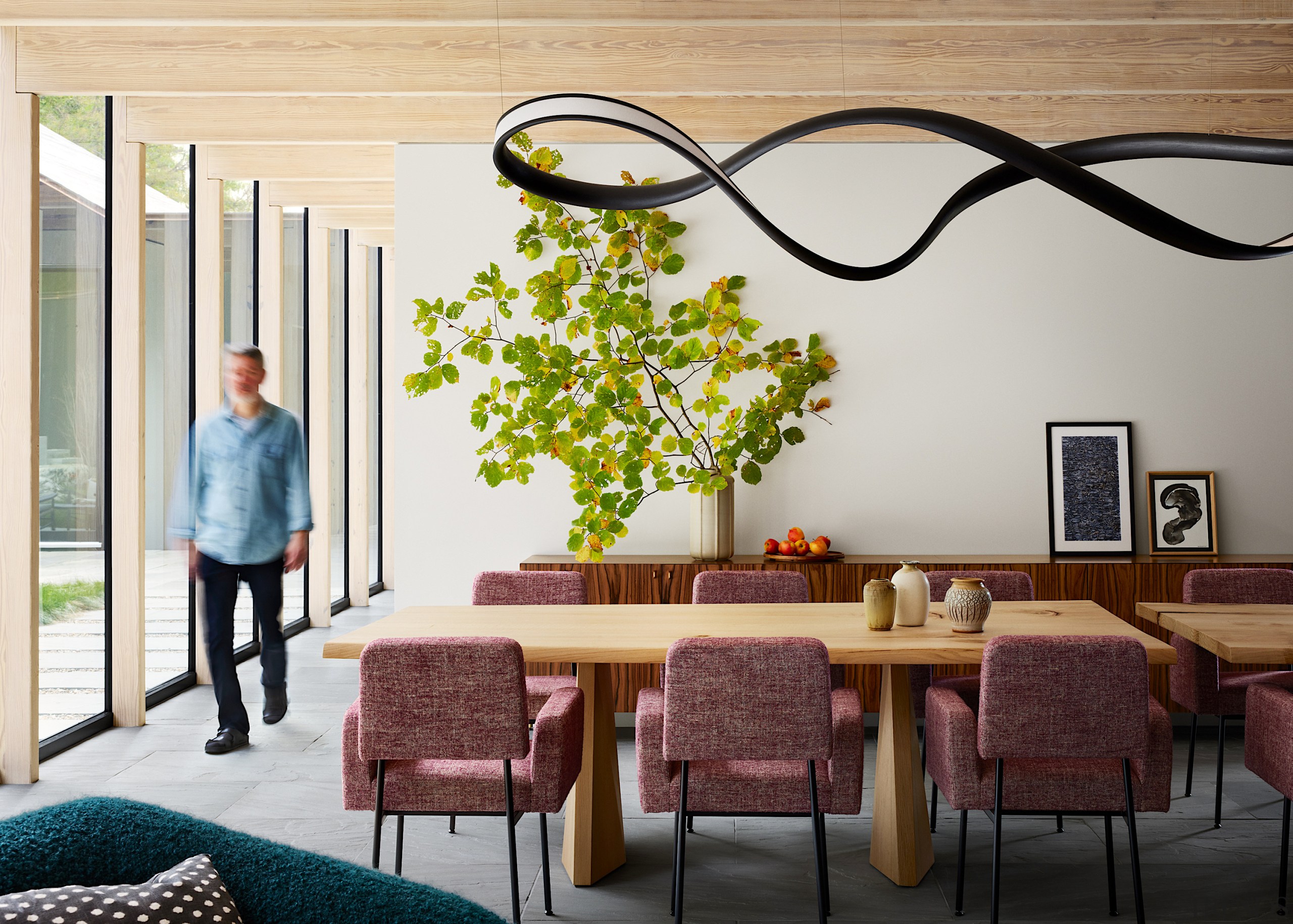 The naturally lit living spaces with sculptural pendant 