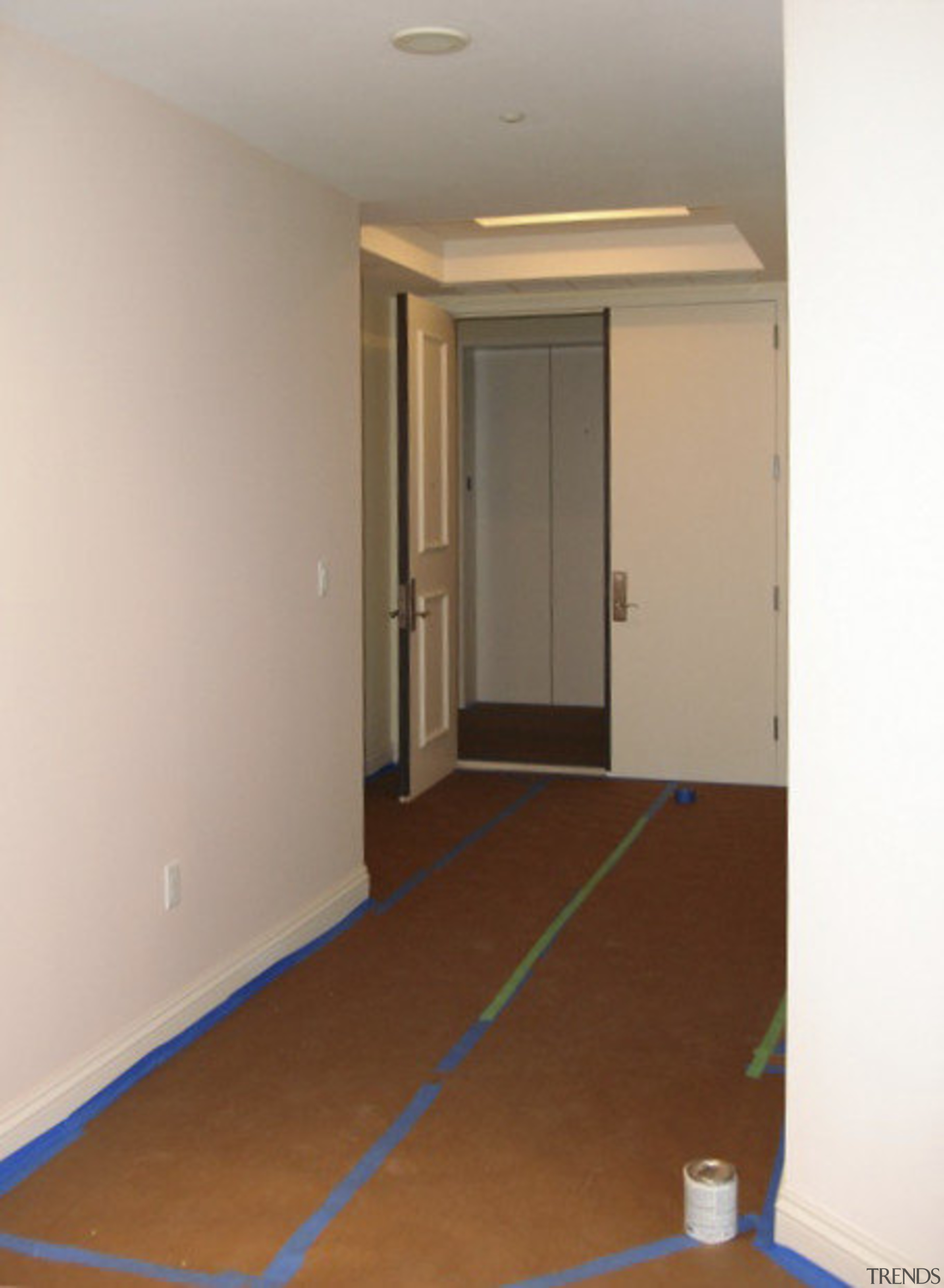 Hallway with door. - Hallway with door. - apartment, ceiling, floor, flooring, hardwood, home, house, interior design, laminate flooring, property, real estate, room, wall, wood, wood flooring, wood stain, gray, brown