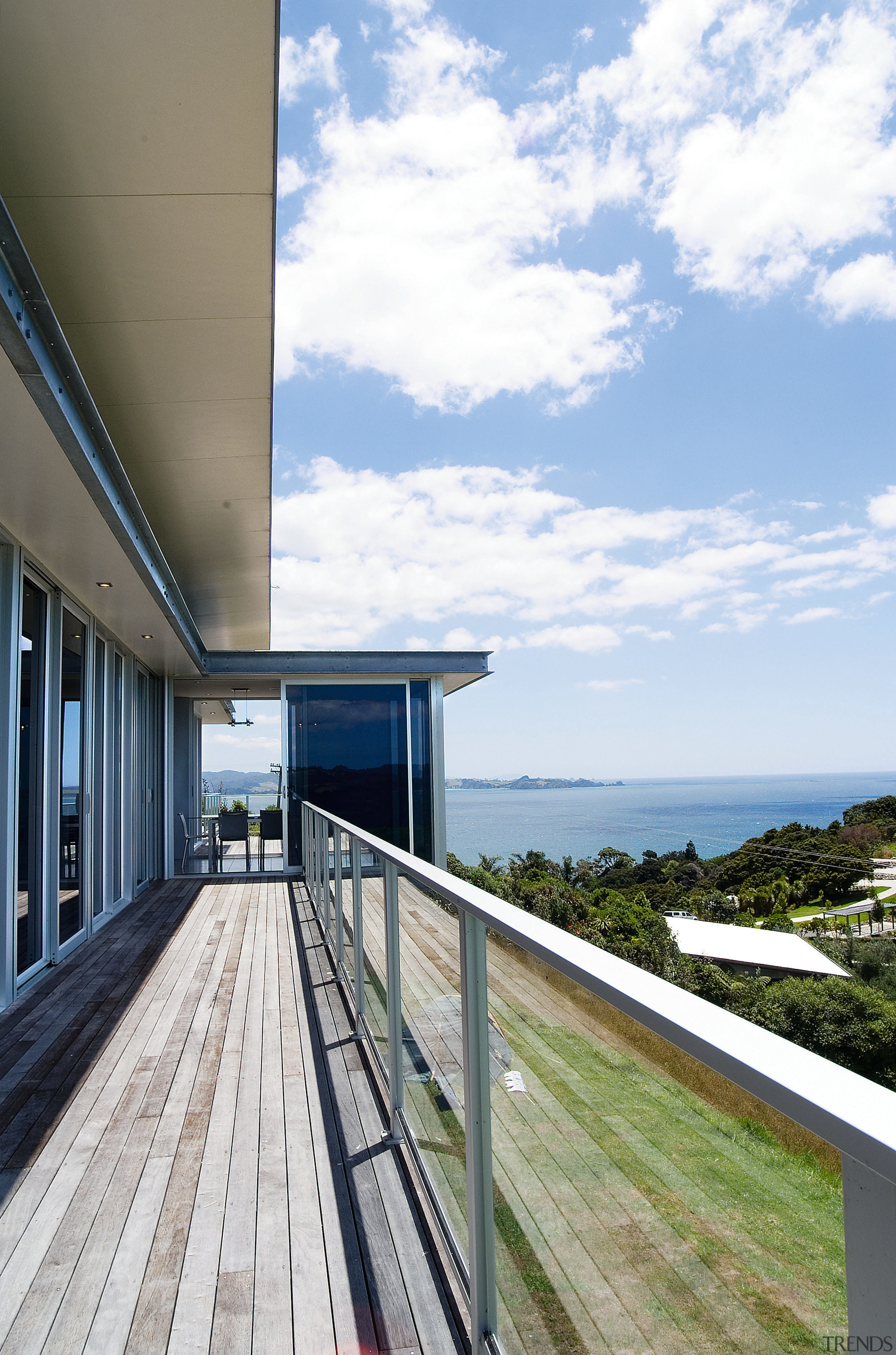 A view of some glass balustrades from Unex architecture, building, home, house, property, real estate, sky, white
