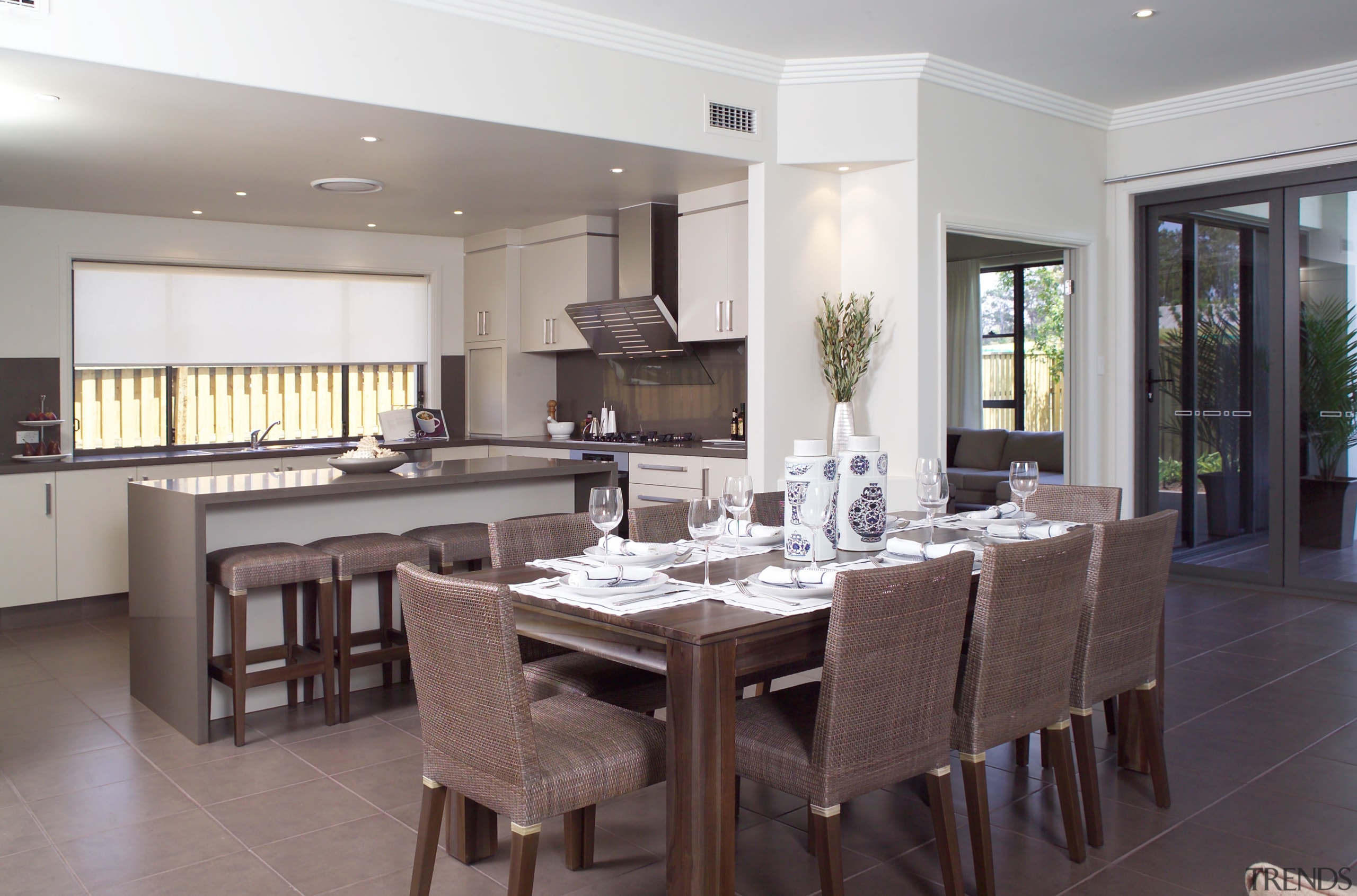 view of the open-plan kitchen and dining area countertop, dining room, floor, flooring, interior design, kitchen, property, real estate, room, table, gray