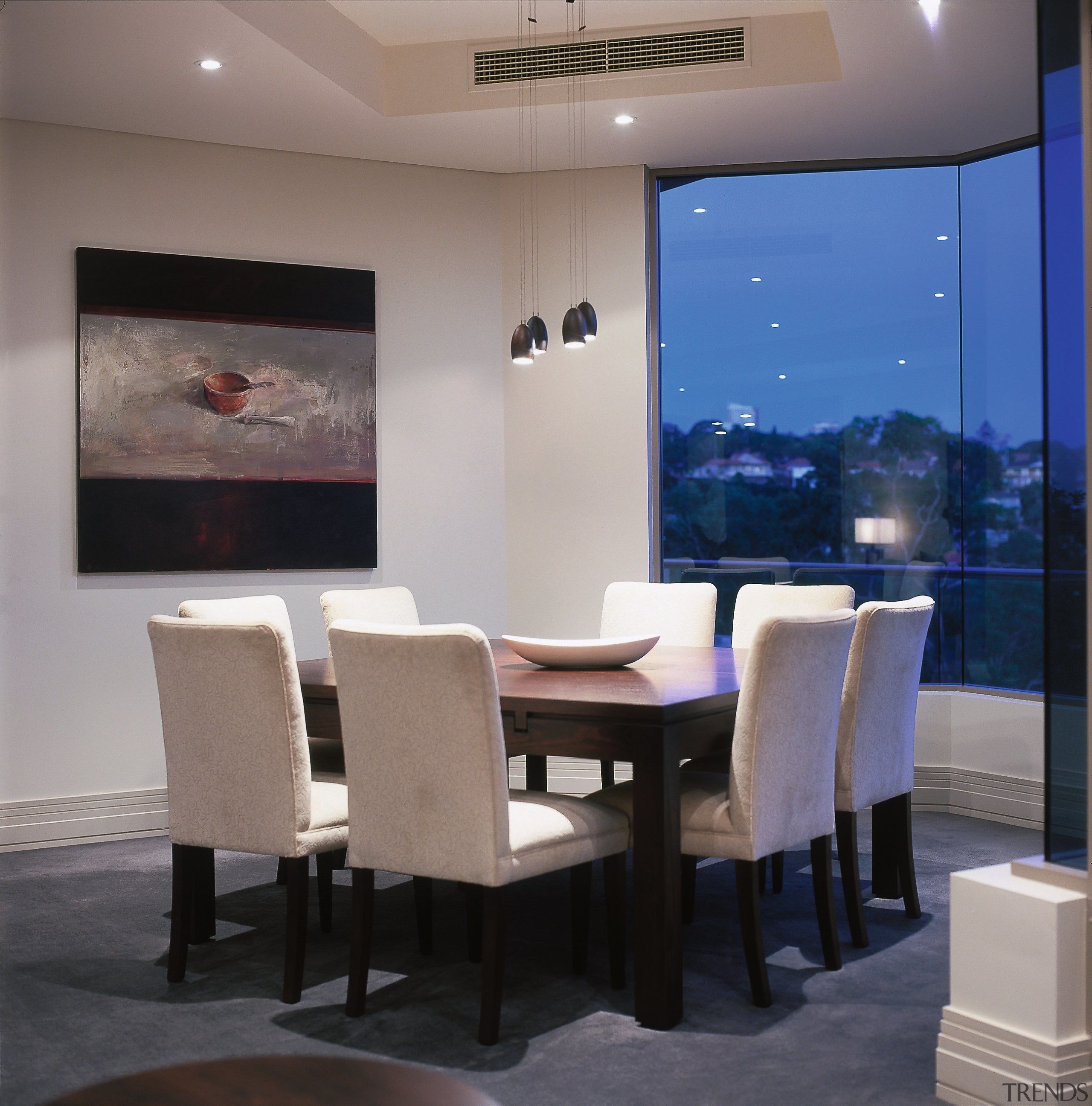 A view of the dining area with a ceiling, chair, dining room, furniture, interior design, room, table, wall, gray