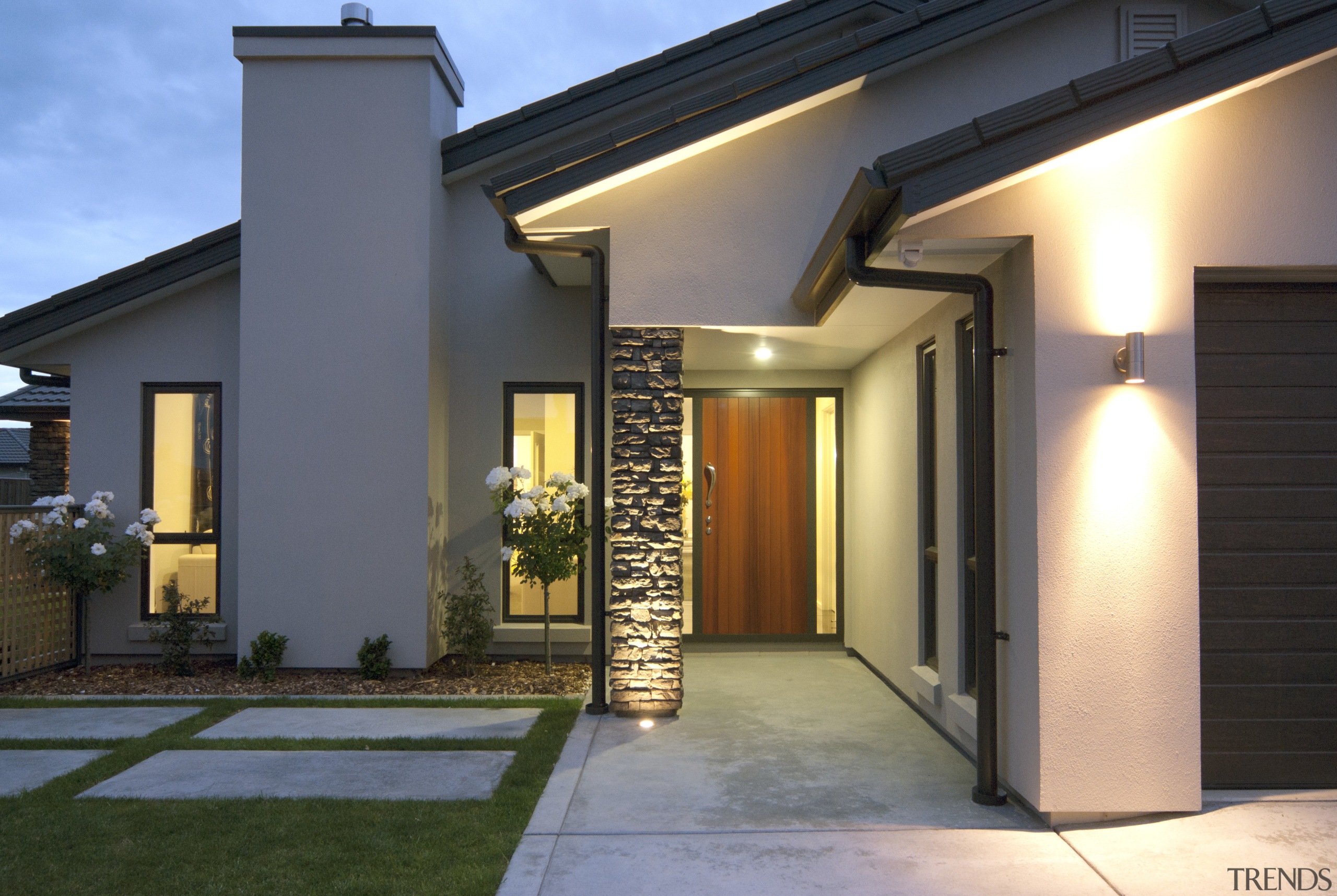 Exterior view of David Reid show home which courtyard, door, estate, facade, home, house, lighting, property, real estate, residential area, roof, siding, window