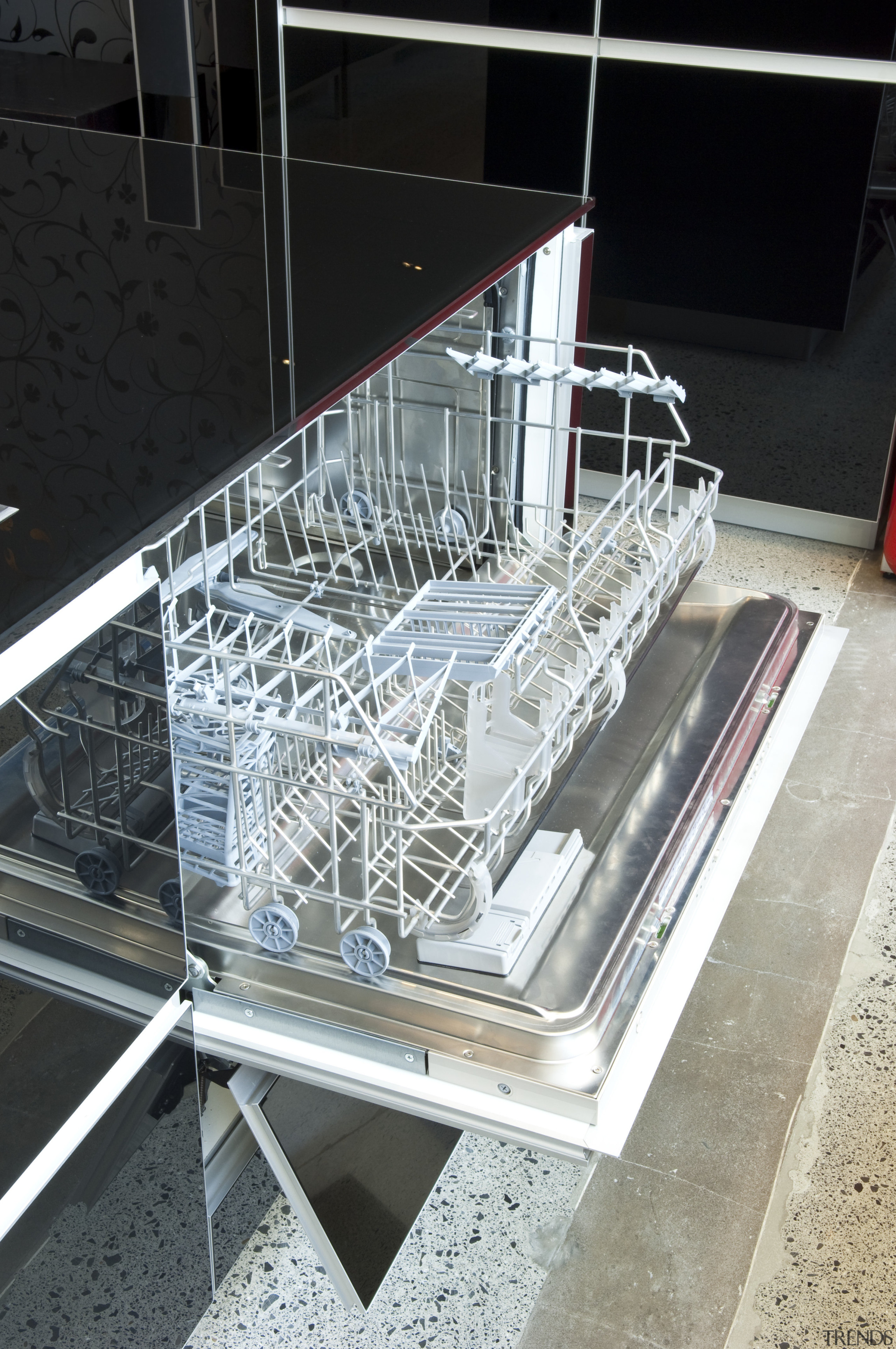 View of kitchen which features integrated Smeg dishwasher black, white