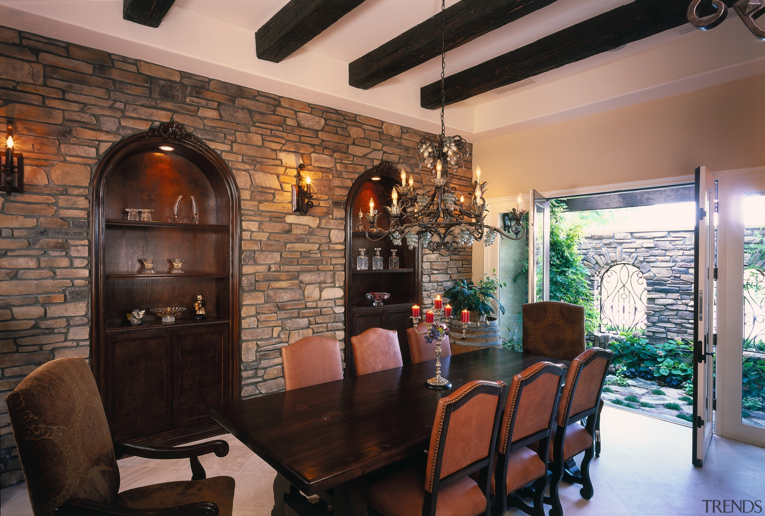 view of the masonry wall showing archway shelving ceiling, dining room, home, interior design, living room, real estate, room, table, wall, black