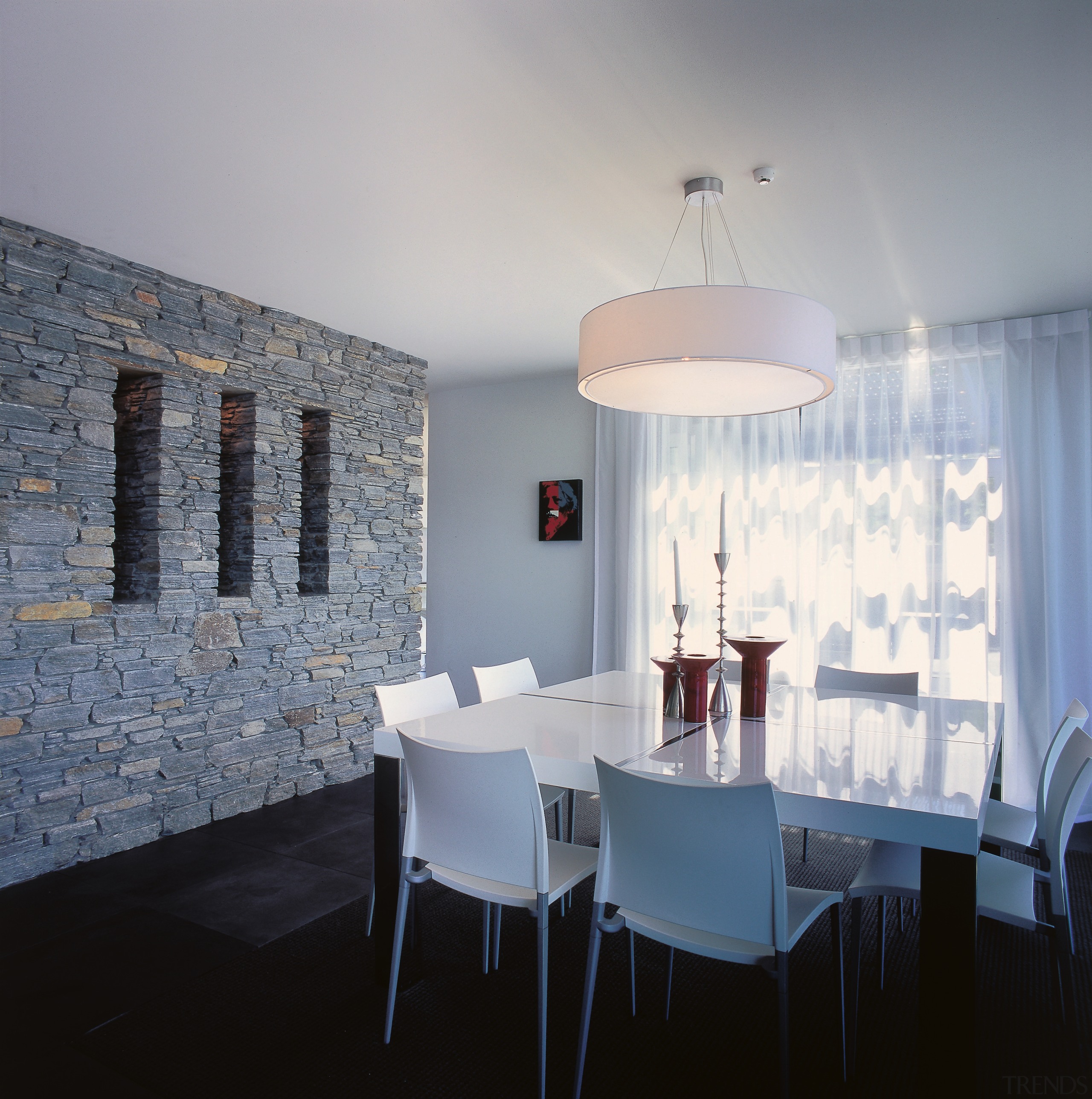 A view of the dining area, black tiled apartment, architecture, ceiling, chair, dining room, furniture, home, interior design, light fixture, lighting, room, table, wall, gray