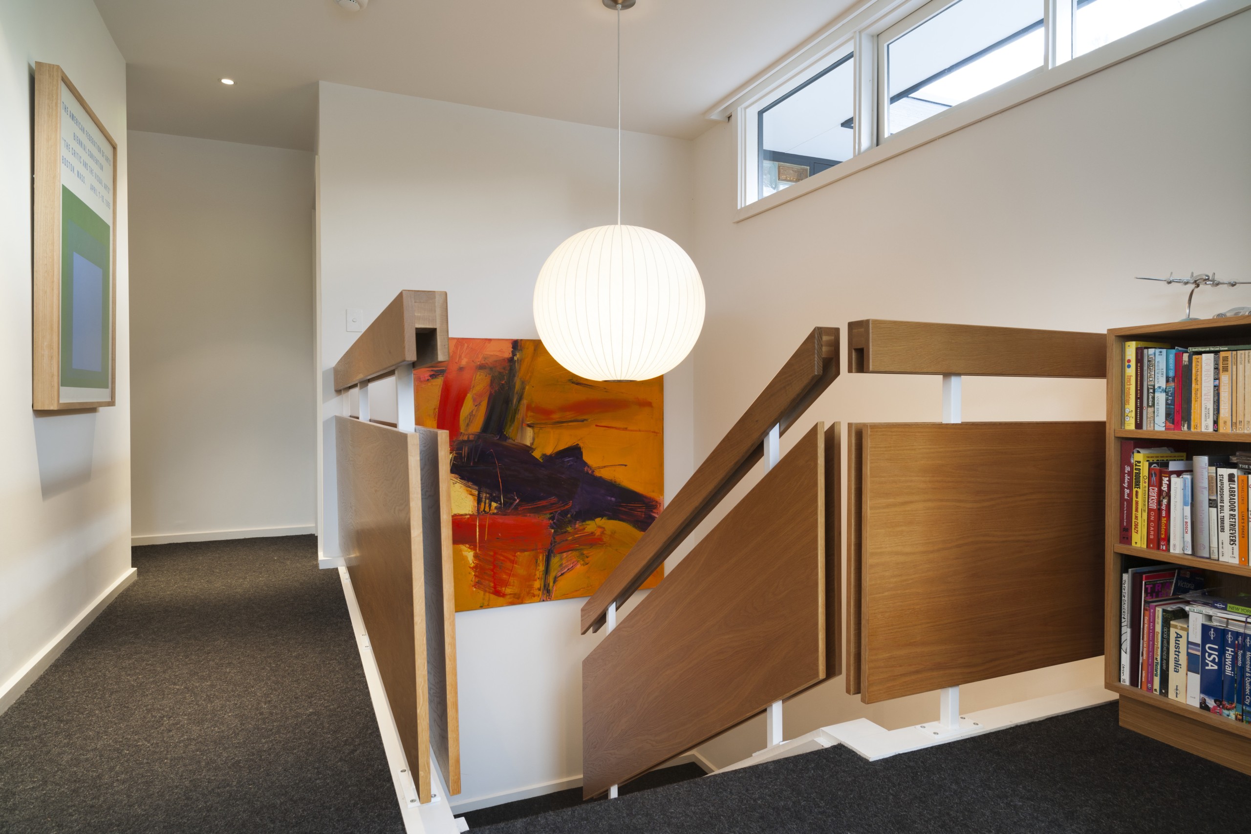 As part of an interior renovation, New American bookcase, floor, flooring, furniture, interior design, room, shelf, shelving, gray, brown