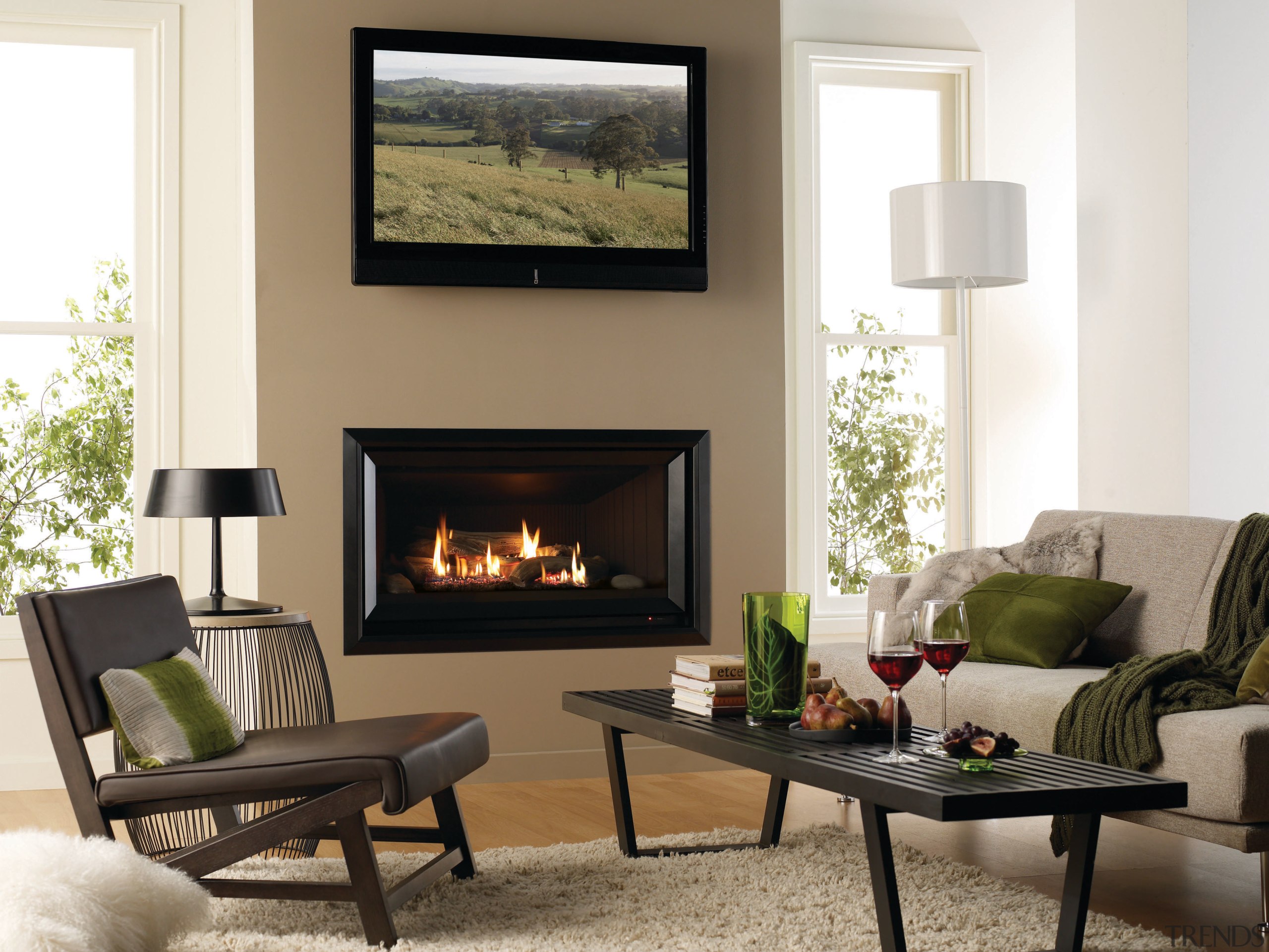 View of a living area which features a fireplace, furniture, hearth, home, interior design, living room, wood burning stove, white, brown