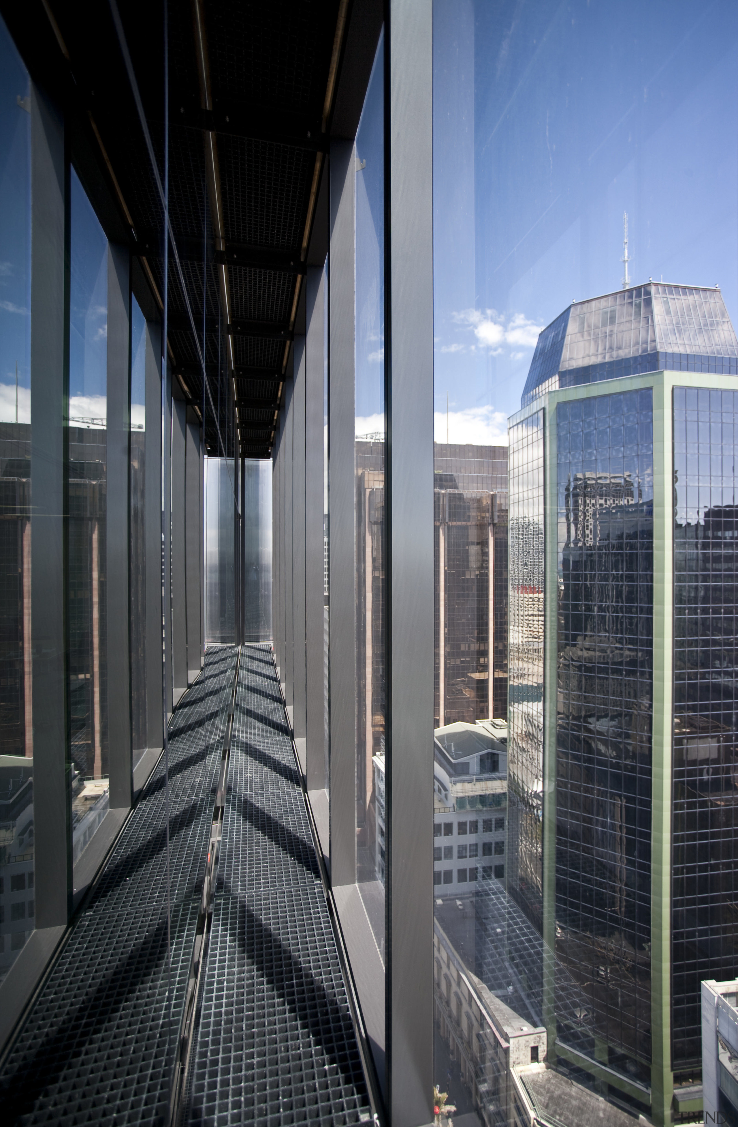 View of the twin facade at the Deloitte architecture, building, city, commercial building, corporate headquarters, daylighting, facade, glass, headquarters, metropolis, metropolitan area, reflection, sky, skyscraper, urban area, black, gray