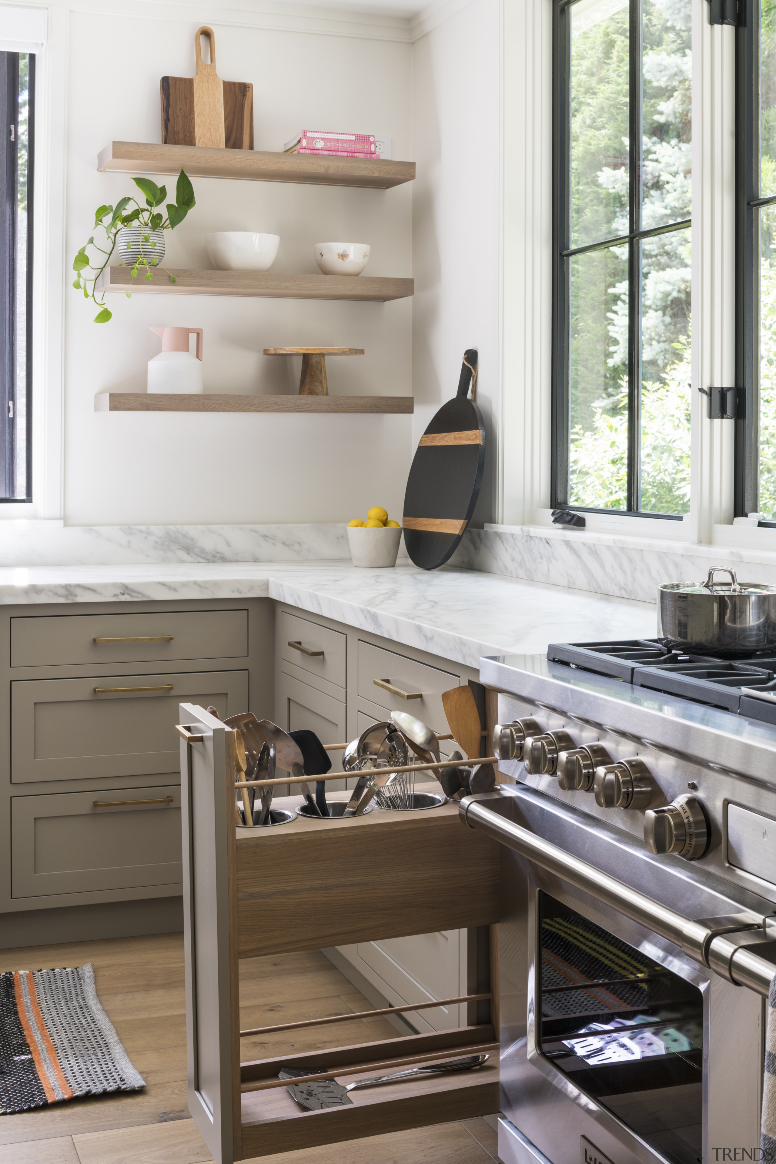 ​​​​​​​Slotted storage ups the functionality in this kitchen. 