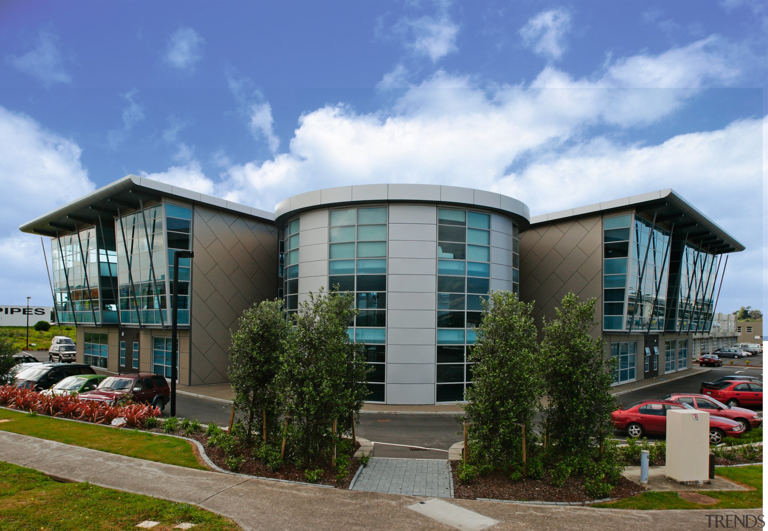 A view of the Jalcon homes building. - architecture, building, commercial building, condominium, corporate headquarters, facade, home, house, mixed use, property, real estate, sky, blue