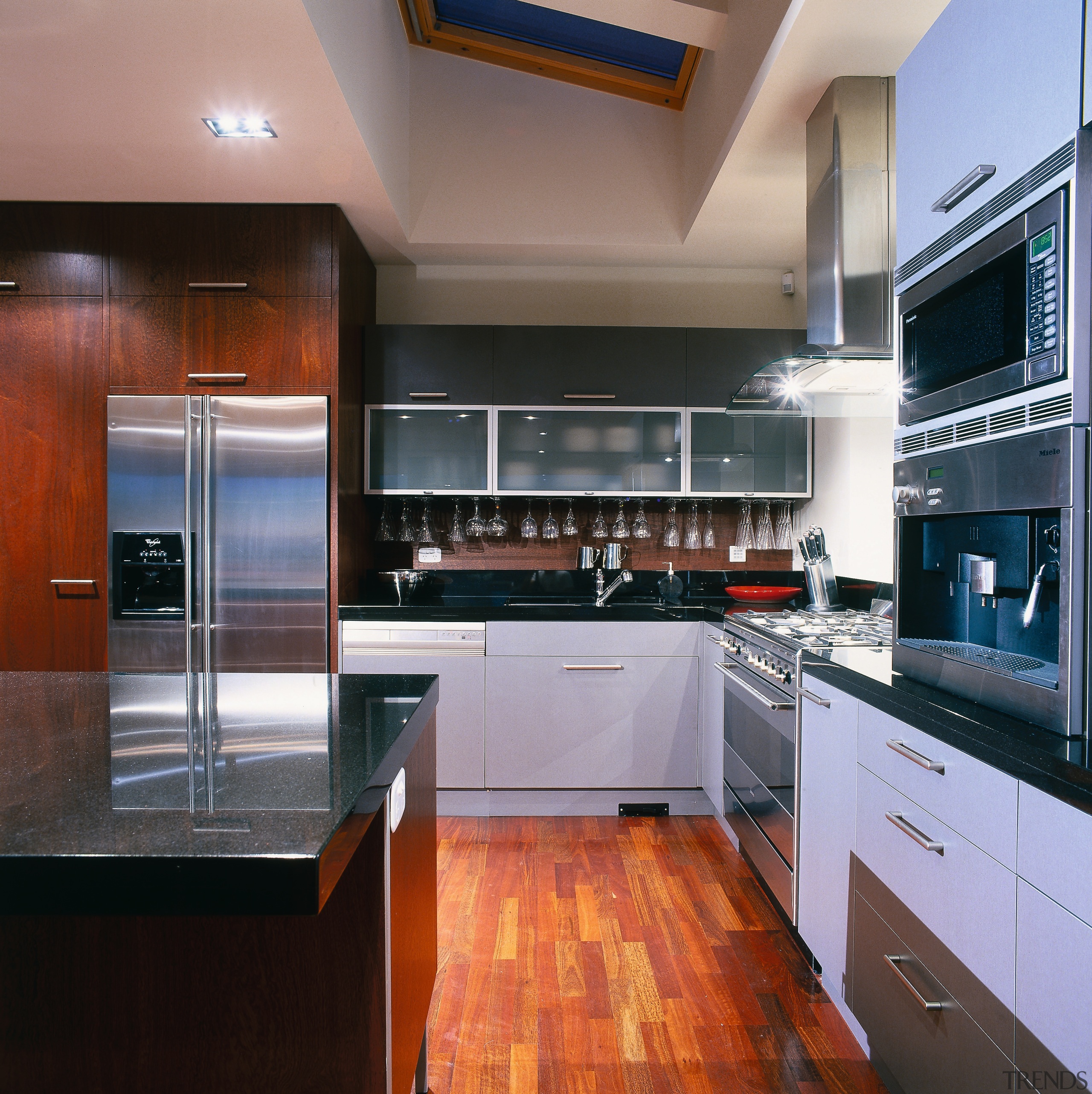 view of entrance into the kitchen area showing cabinetry, countertop, cuisine classique, interior design, kitchen, real estate, room, black