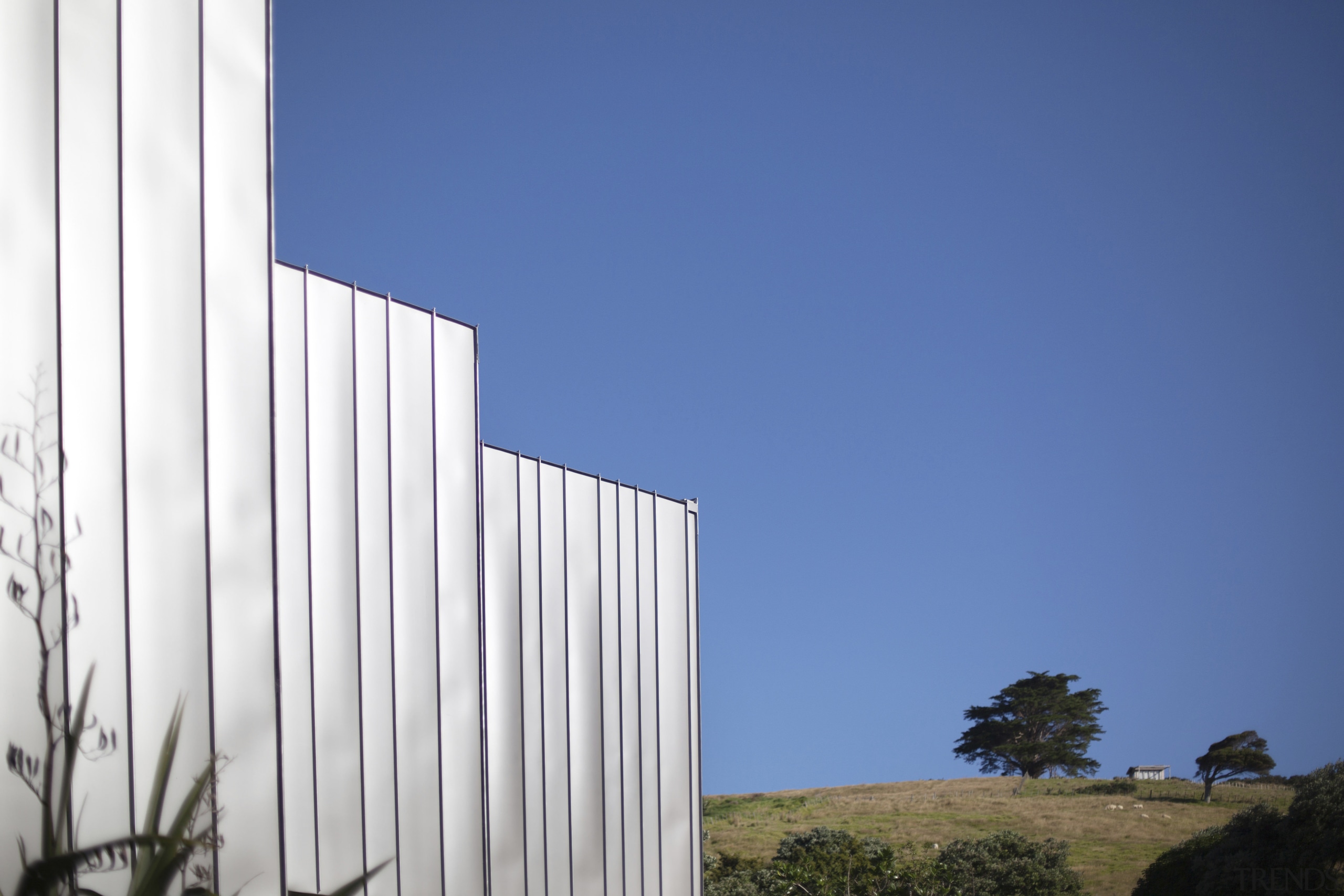 View of building and sky. - View of architecture, building, daytime, facade, house, sky, structure, blue, white