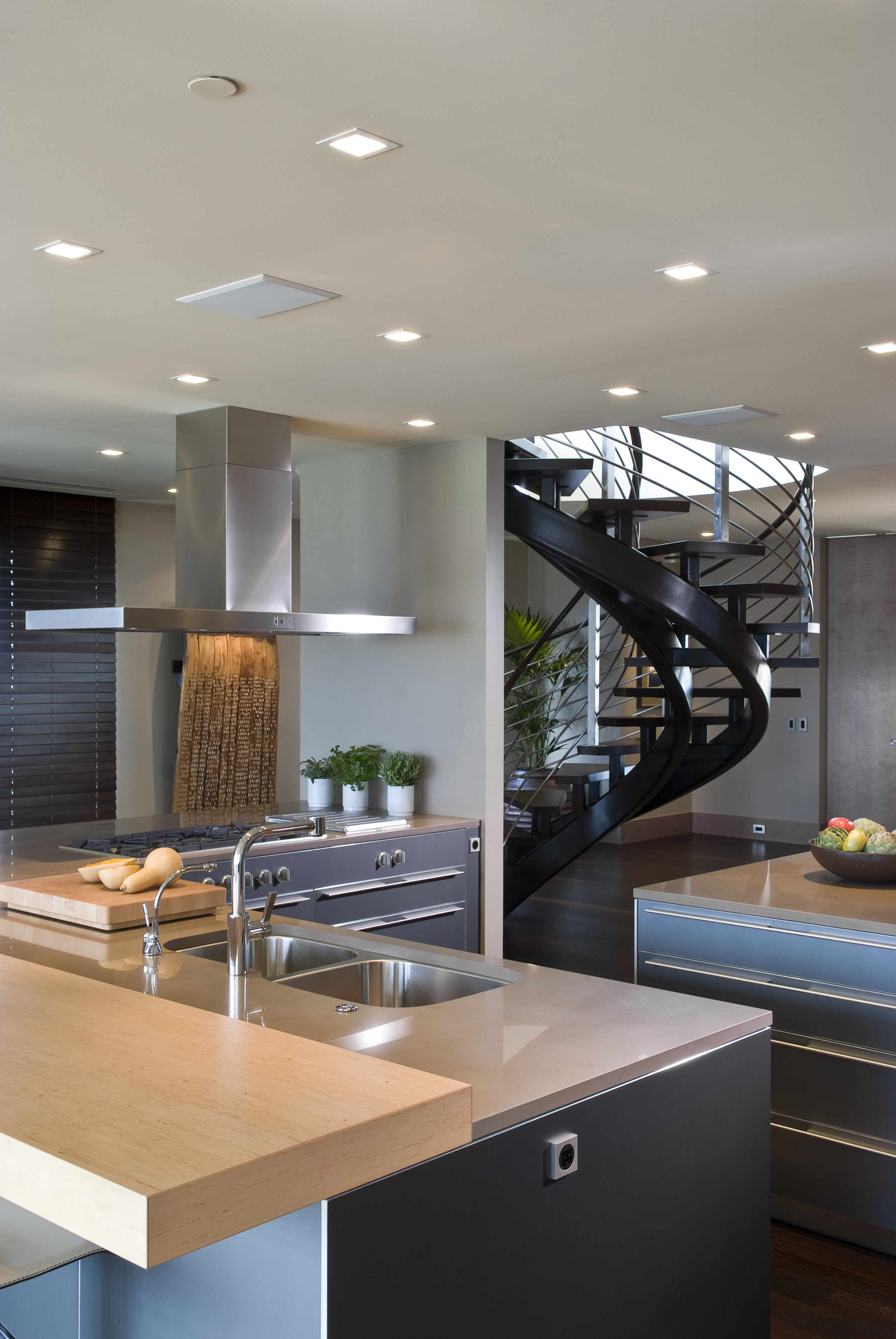 View of contemporary condominium kitchen which features aluminium countertop, interior design, kitchen, gray