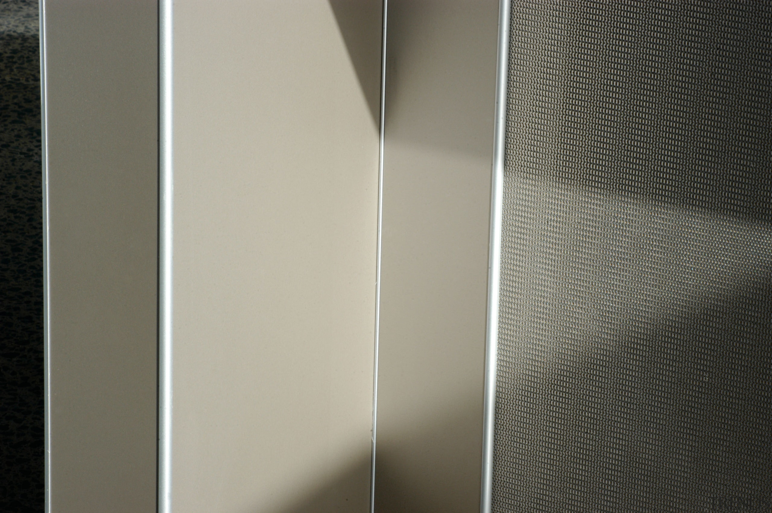 Closeup of textured Laminex laminate panels with contrasting angle, interior design, light, line, product design, structure, wood, gray, black