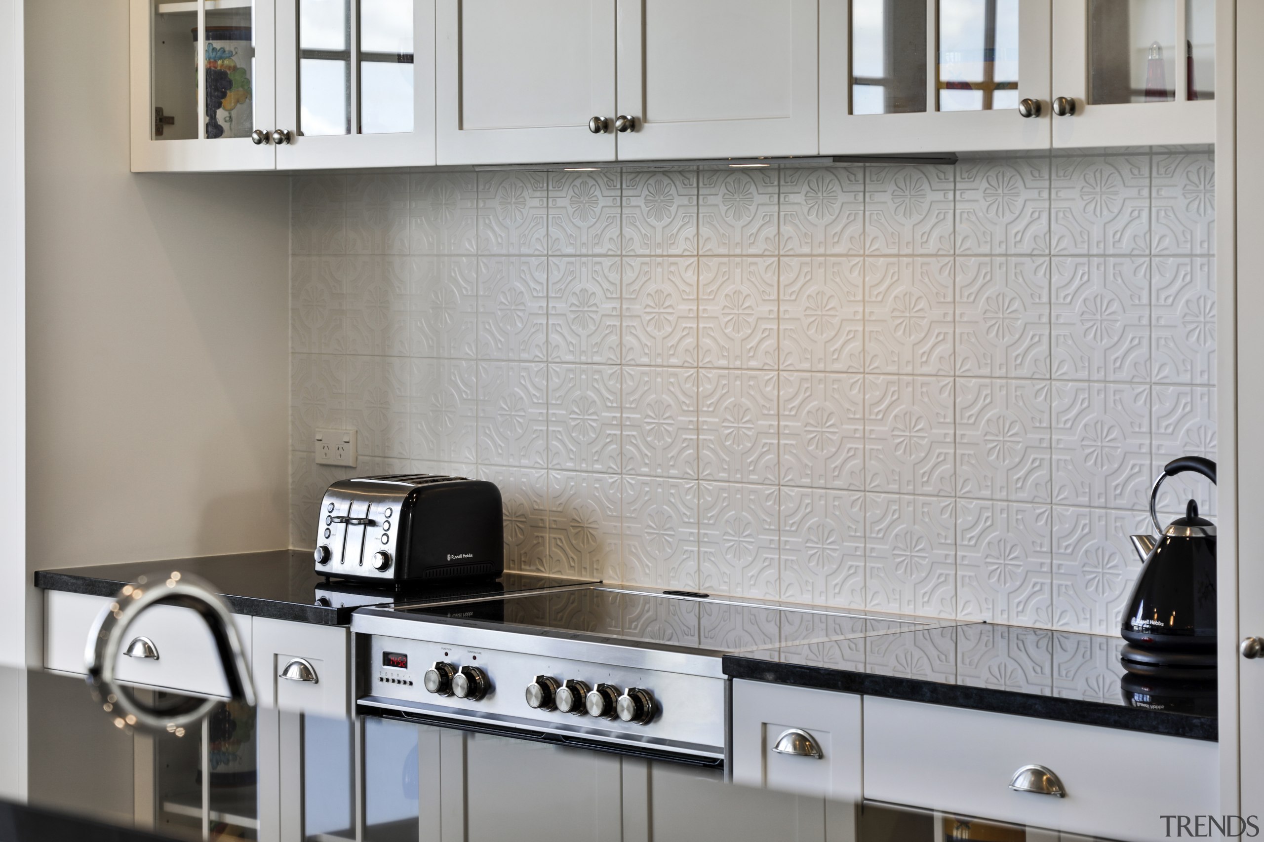 The elegant embossed tile splashback was also installed 