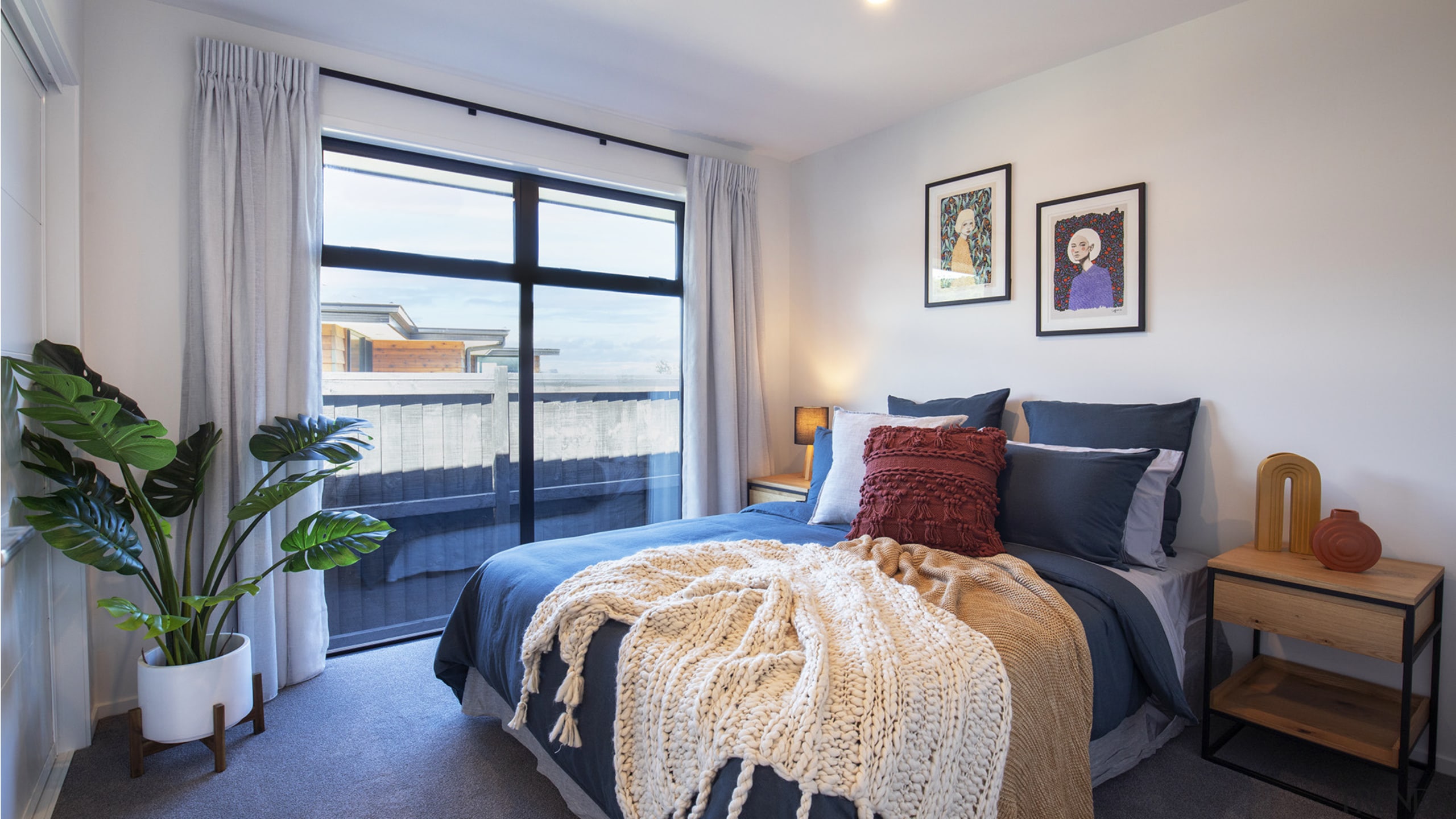 The private master bedroom with near floor-to-ceiling windows. 