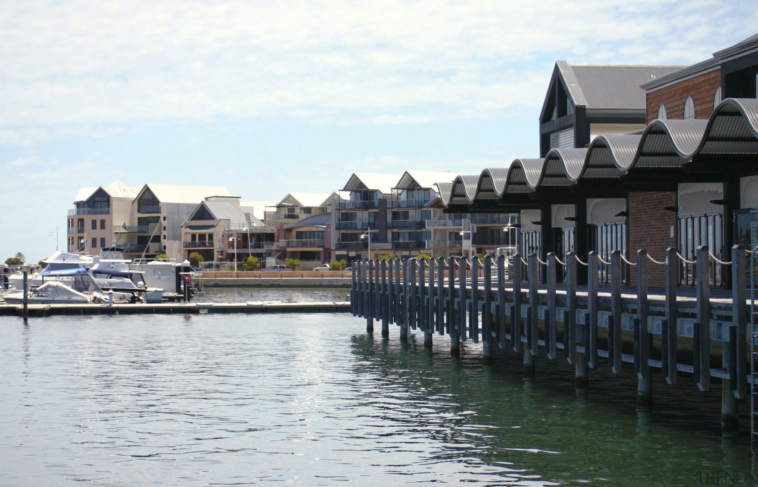 View of the Mandurah Ocean Marina which was boating, canal, channel, city, dock, harbor, home, lake, marina, real estate, reflection, sky, town, water, water transportation, waterway, white, black