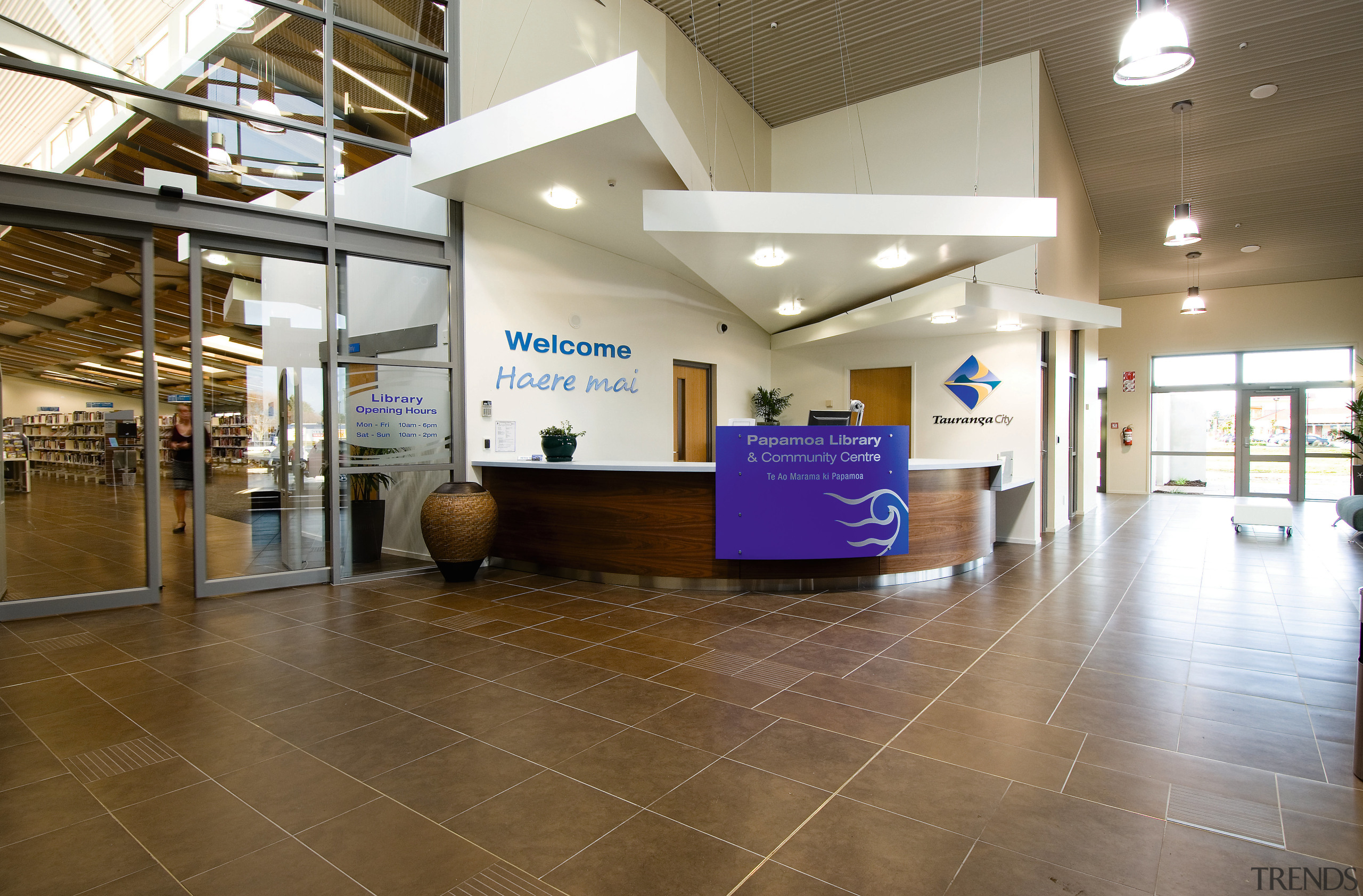 A view of the Papamoa Library constructed by ceiling, floor, flooring, institution, interior design, lobby, real estate, brown, white