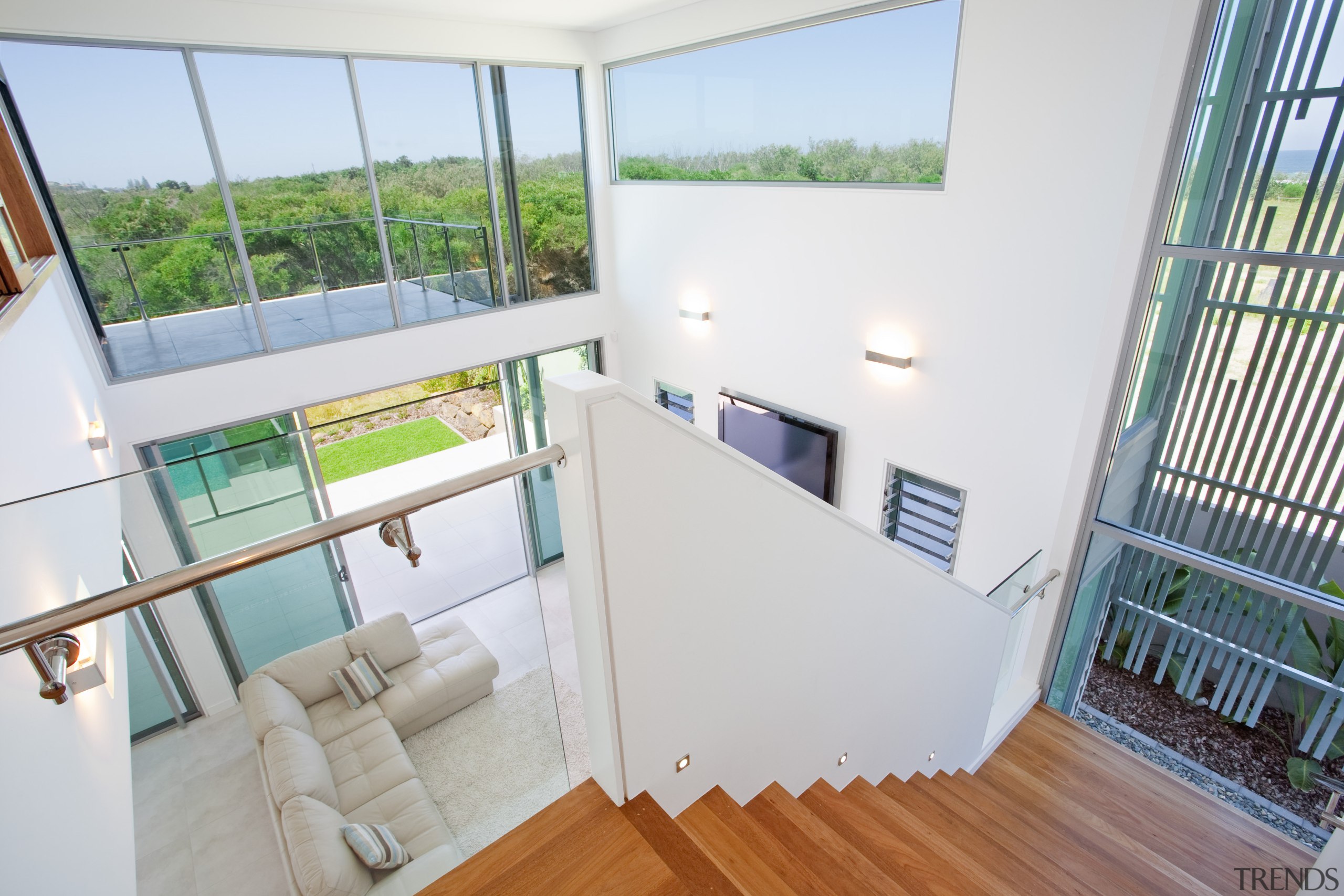 View of stairway leading to the upper level architecture, balcony, daylighting, estate, handrail, home, house, property, real estate, room, window, white