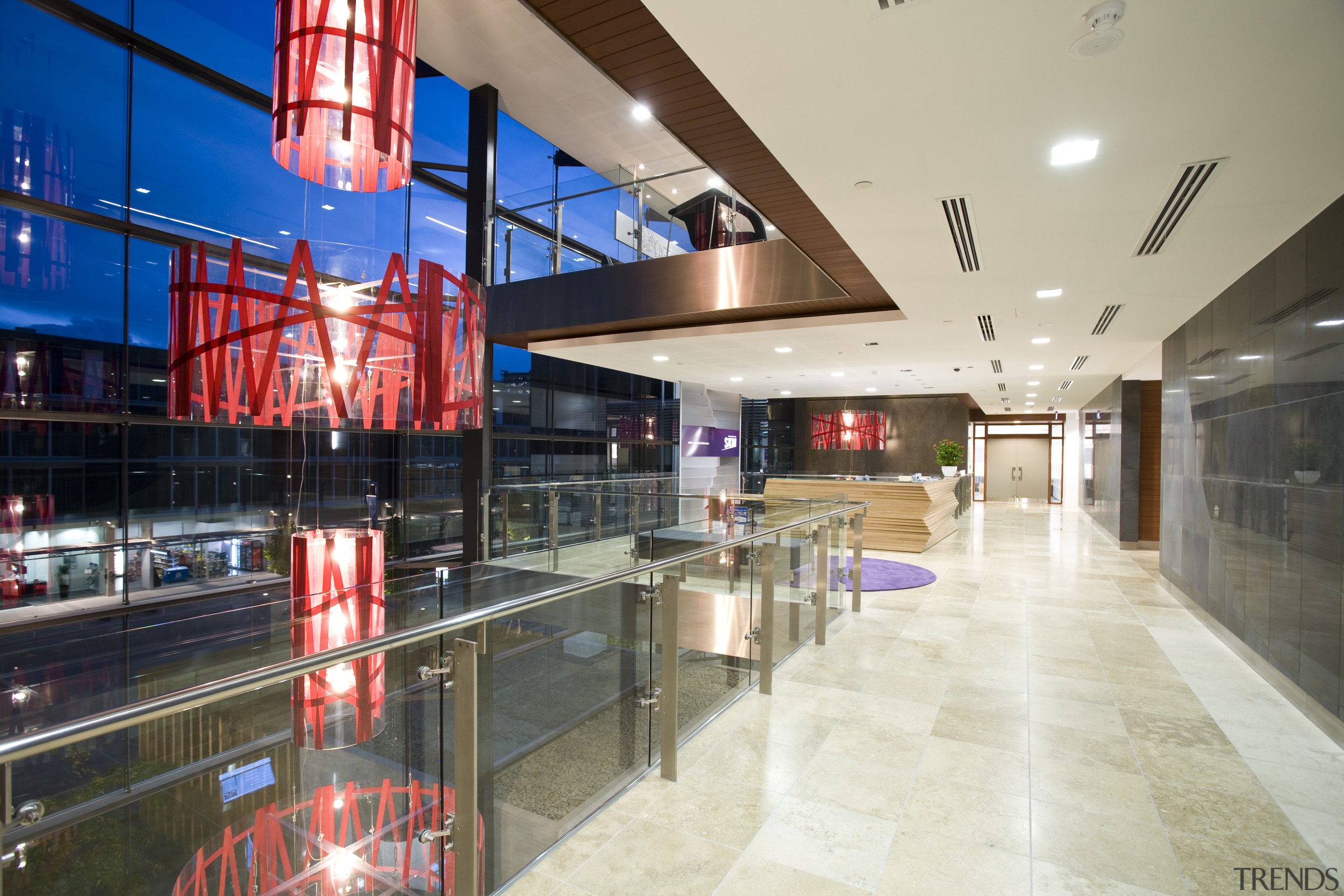 View of the reception area which features glass interior design, lobby, shopping mall, gray