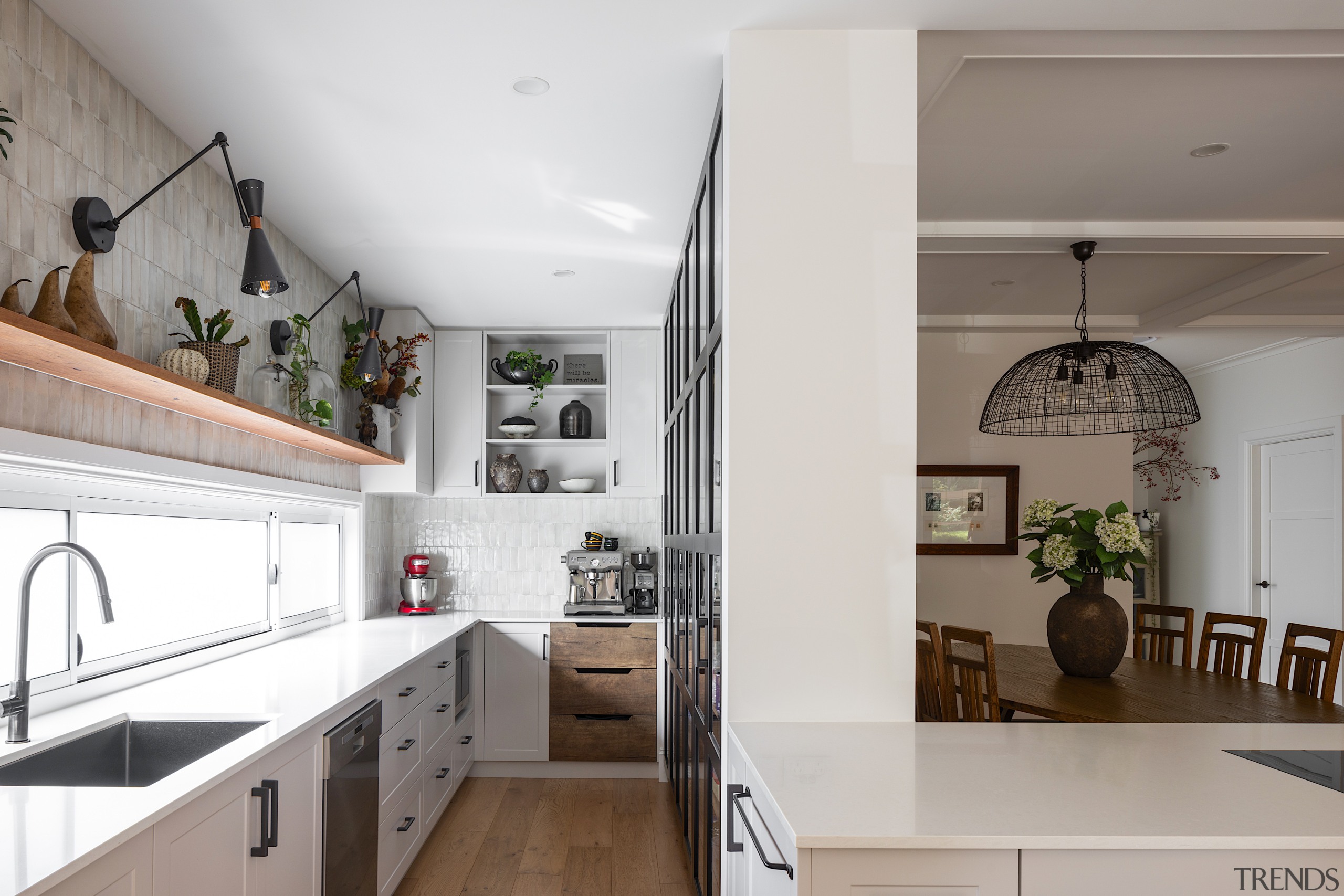 Kitchen with open shelving and feature wall tiles 