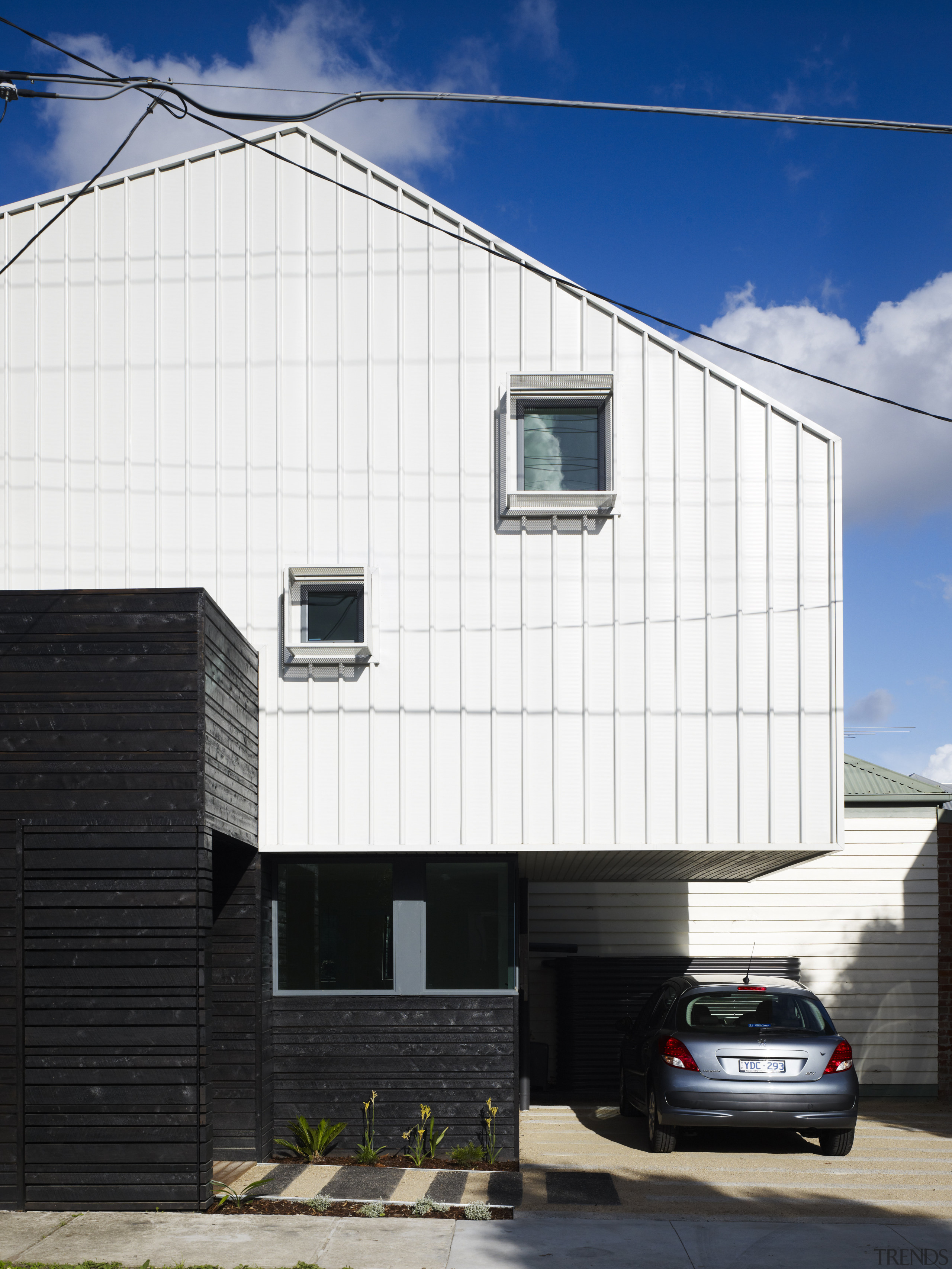 exterior of another house by same architects, garage architecture, building, car, commercial building, facade, home, house, real estate, residential area, siding, sky, white, black