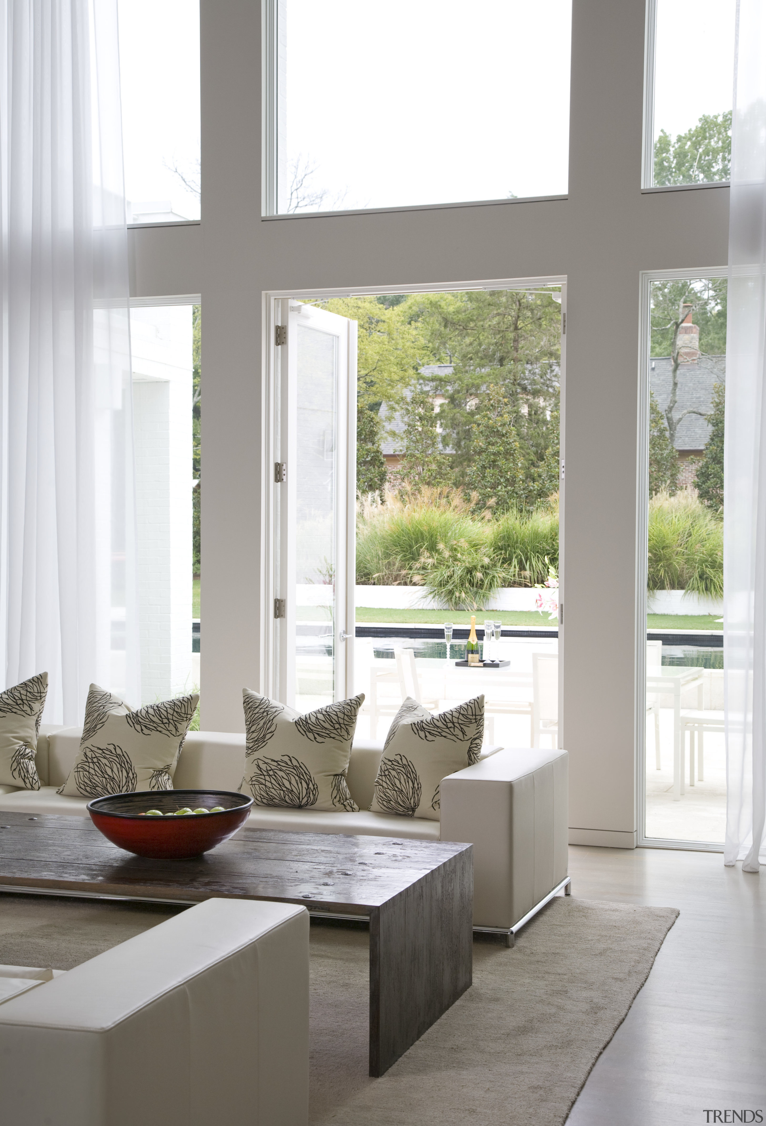 Interior view of the lounge overlooking the pool floor, furniture, home, house, interior design, living room, table, window, white, gray