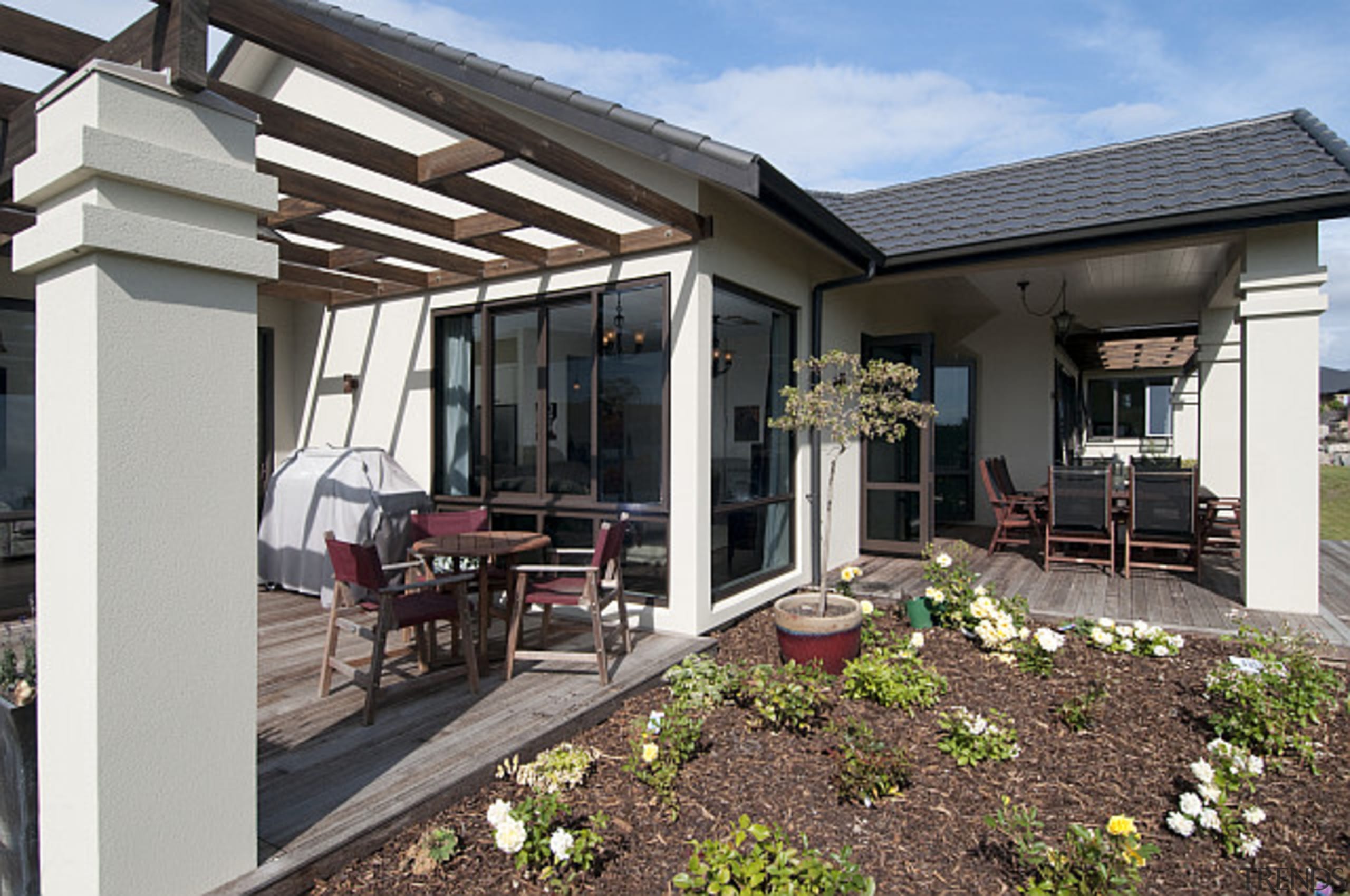 Multiple outdoor spaces in this home built by home, house, outdoor structure, patio, property, real estate, siding, window, gray, black