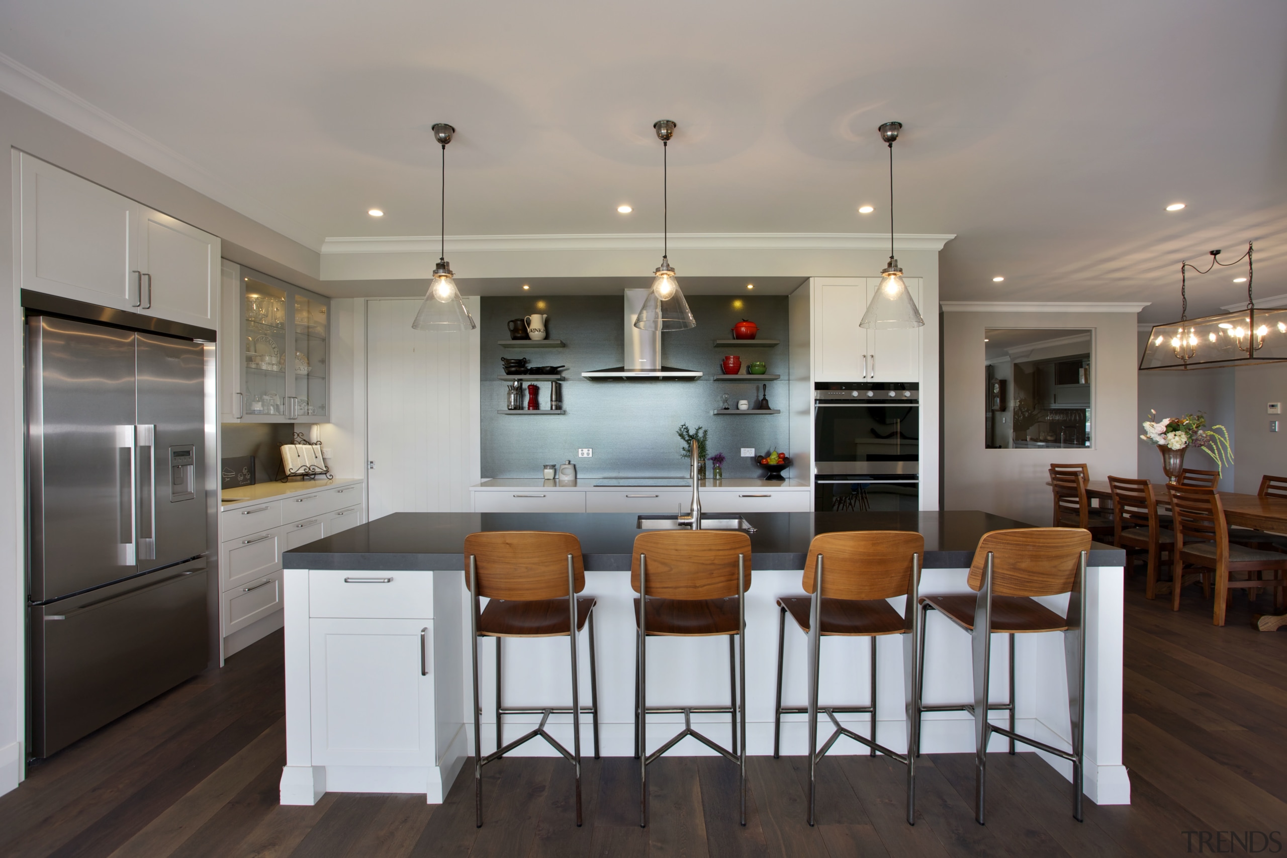 A dark splashback, charcoal grey island benchtop and cabinetry, countertop, cuisine classique, interior design, kitchen, real estate, room, gray