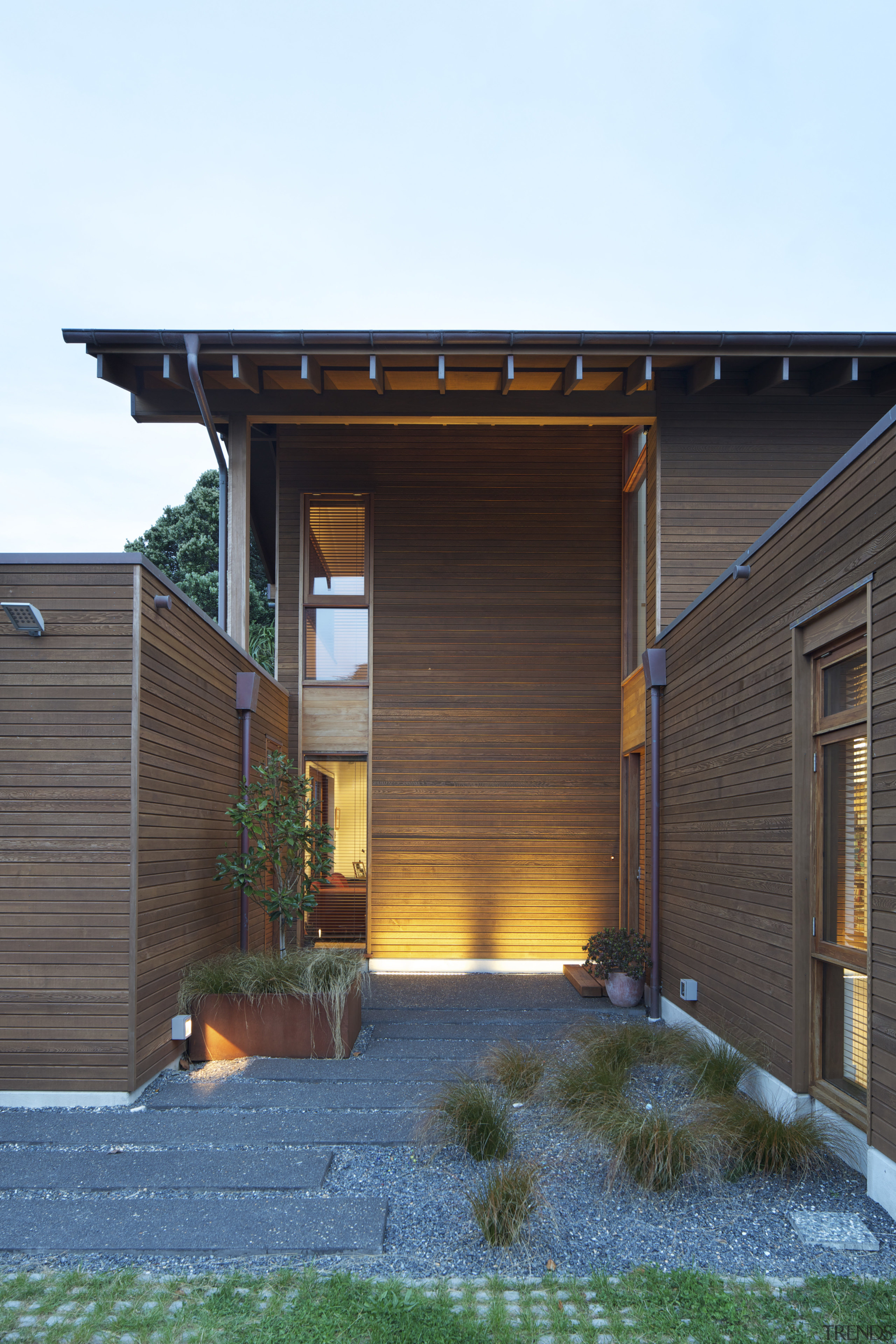 Coastal connections this house by Richard Middleton opens architecture, facade, home, house, outdoor structure, real estate, residential area, roof, shed, siding, white