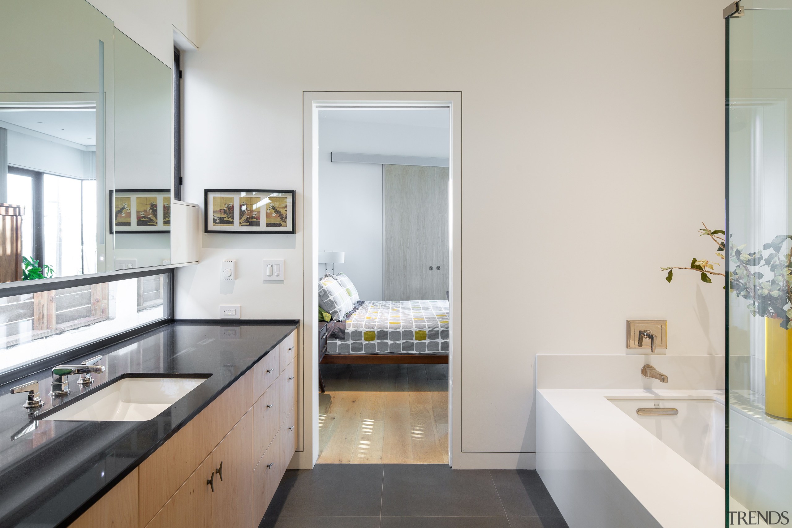 The master ensuite features the same cabinetry look 