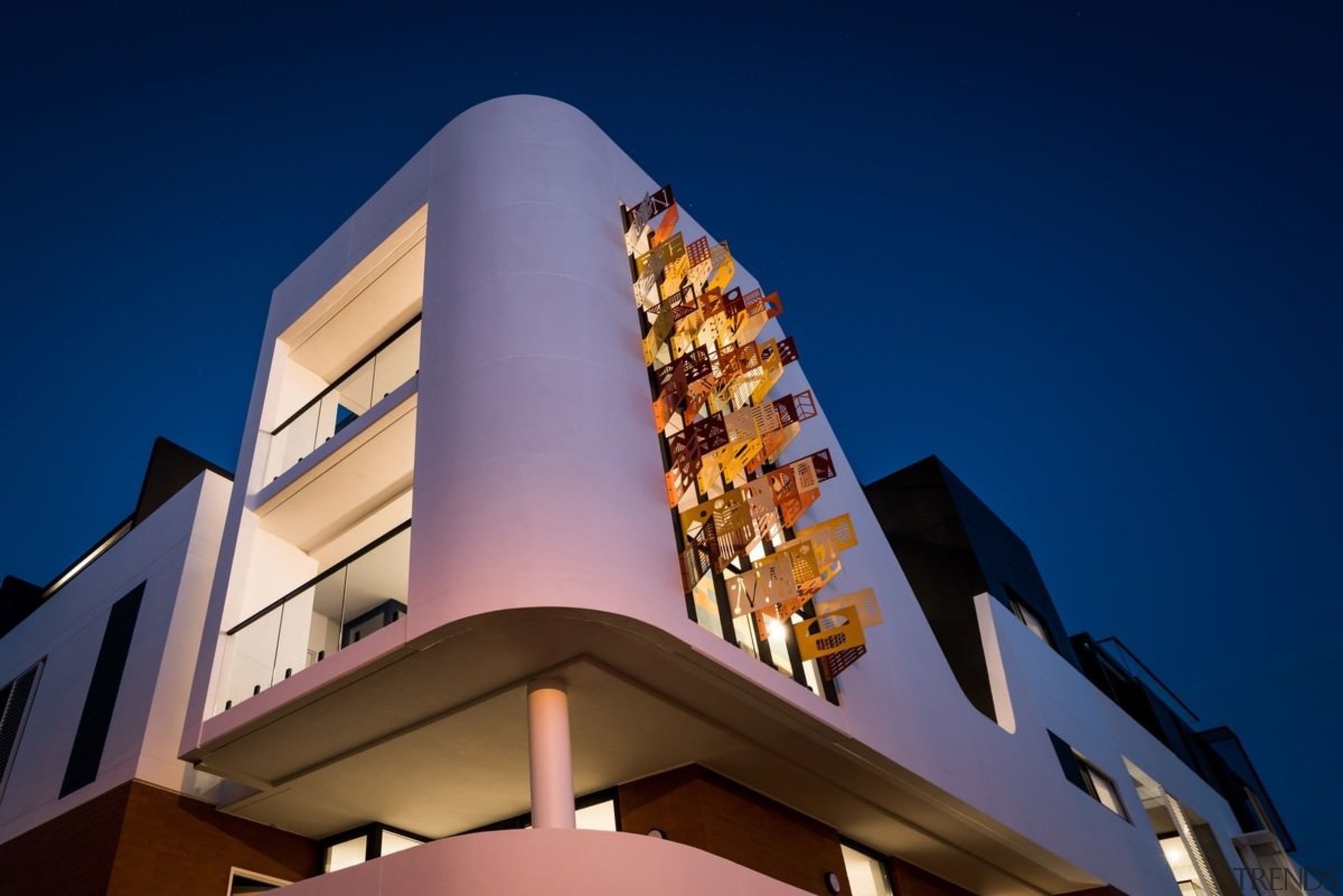 The mural-esque panels light up at night - architecture, building, facade, sky, blue