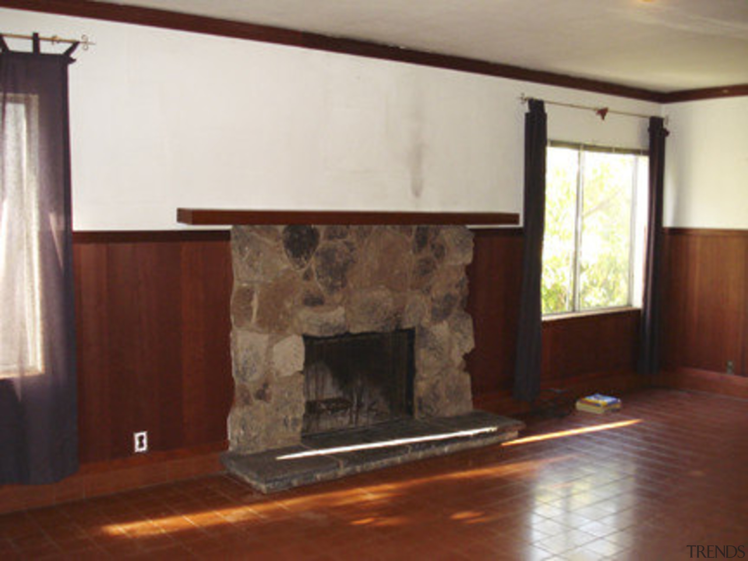 Before shot of lounge. - Before shot of fireplace, floor, flooring, hardwood, hearth, home, interior design, living room, property, room, wall, wood, wood flooring, red, white