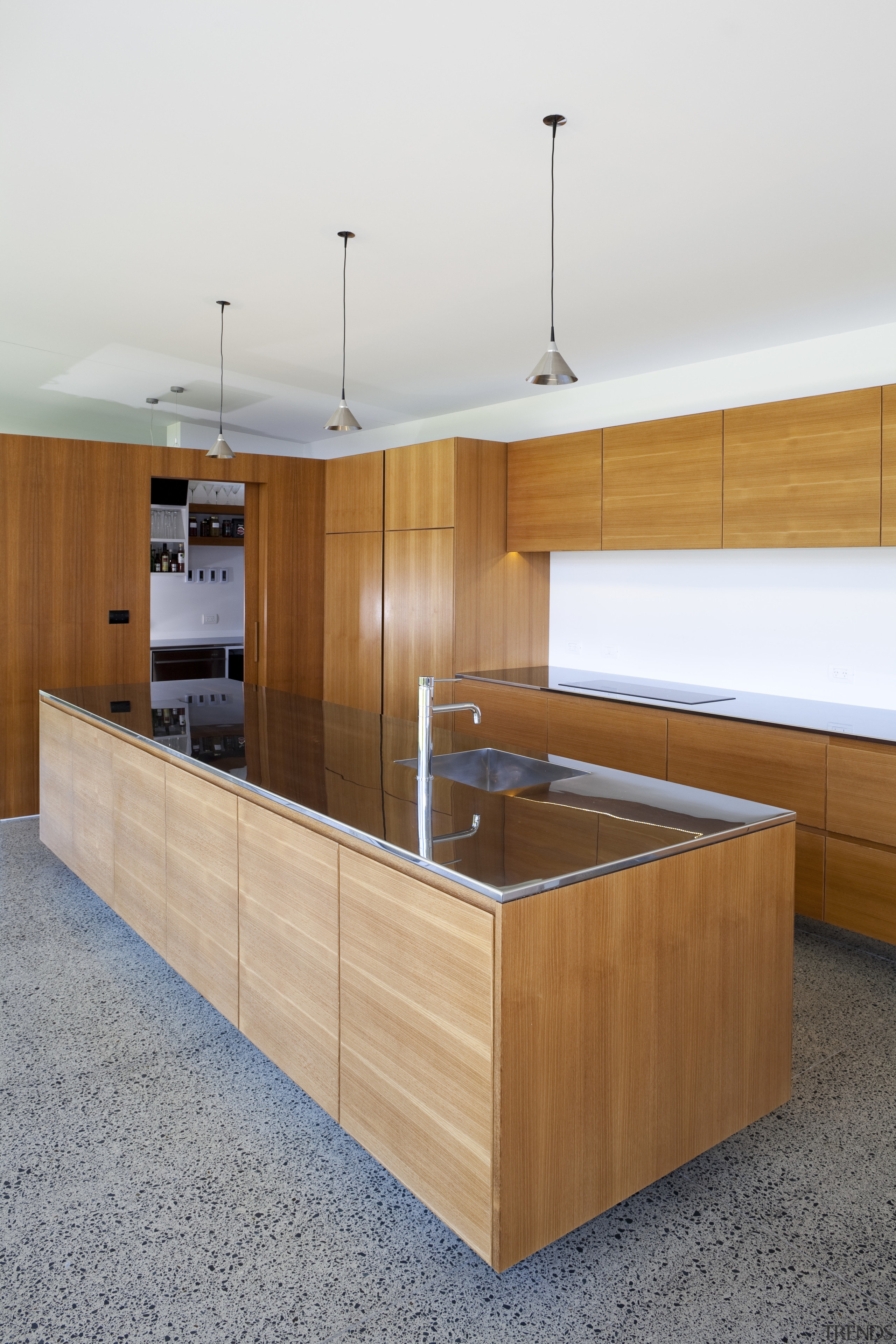 Expansive kitchen with stainless steel countertops and wood cabinetry, countertop, furniture, interior design, kitchen, plywood, product design, wood, white