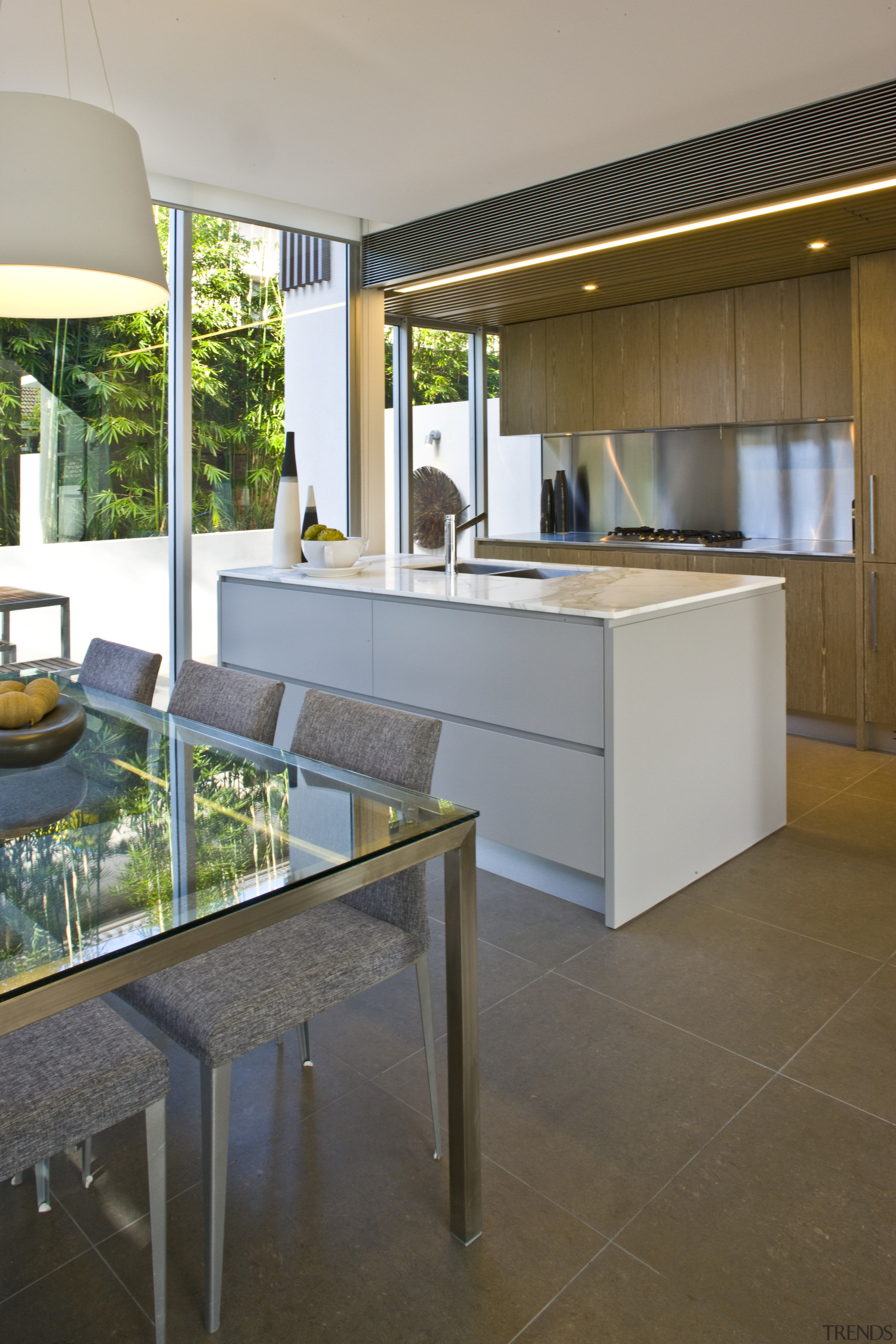 View of kitchen with tiled floors and glass architecture, floor, flooring, house, interior design, real estate, gray, brown