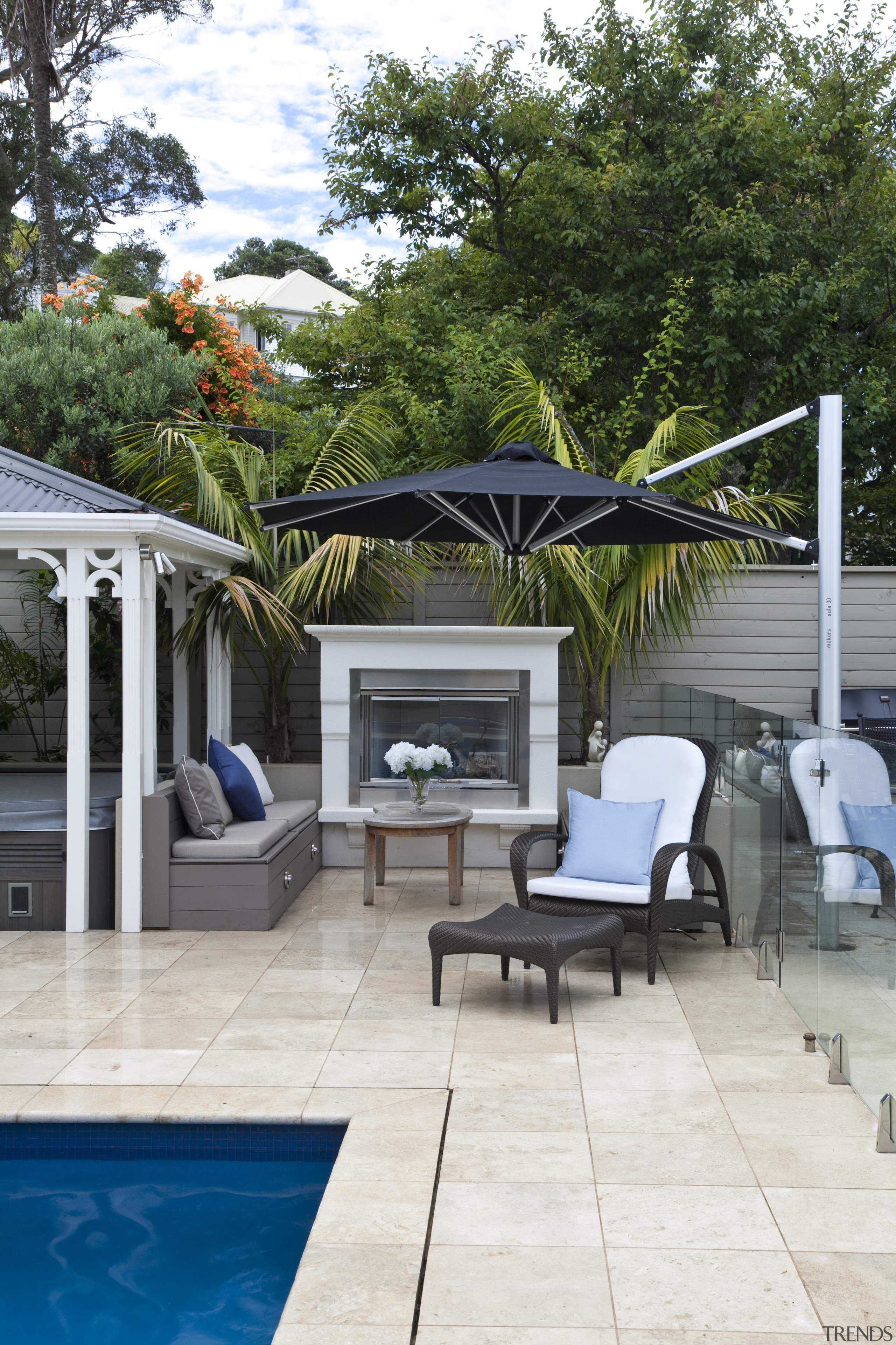 View of outdoor area with pool, paving, fountain, backyard, home, house, outdoor furniture, outdoor structure, patio, real estate, sunlounger, swimming pool, white