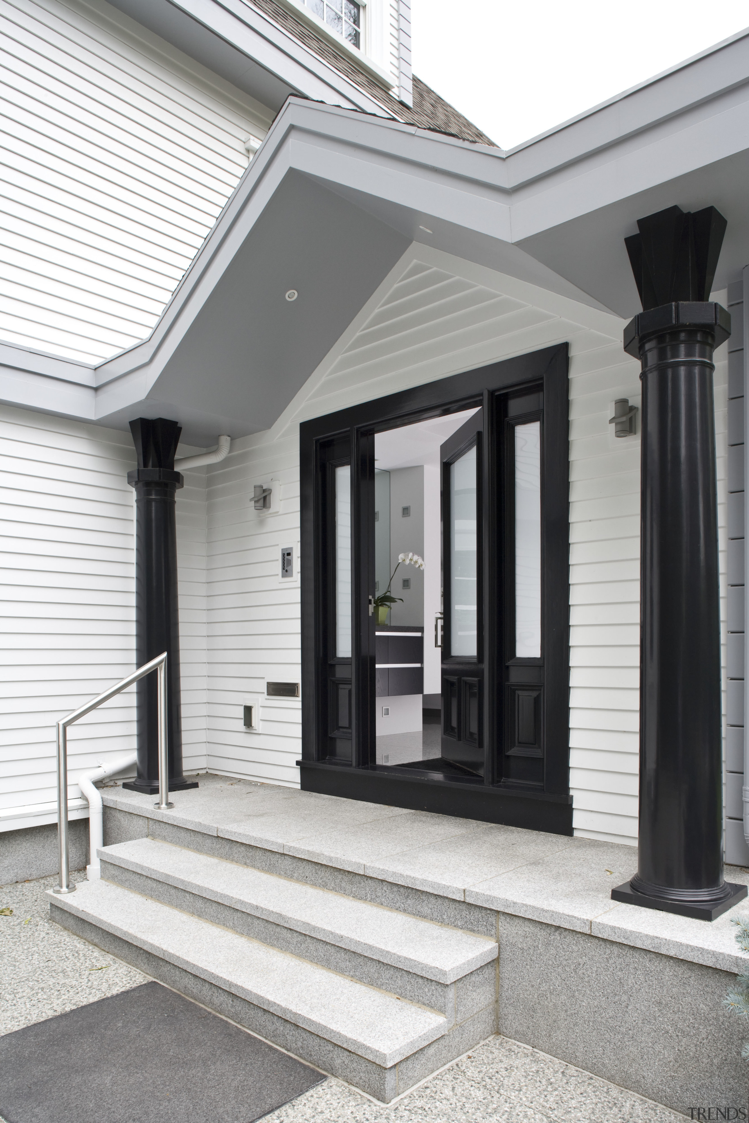 Exterior view of house featuring landscaping, oak roofing, column, house, porch, siding, structure, window, white, gray