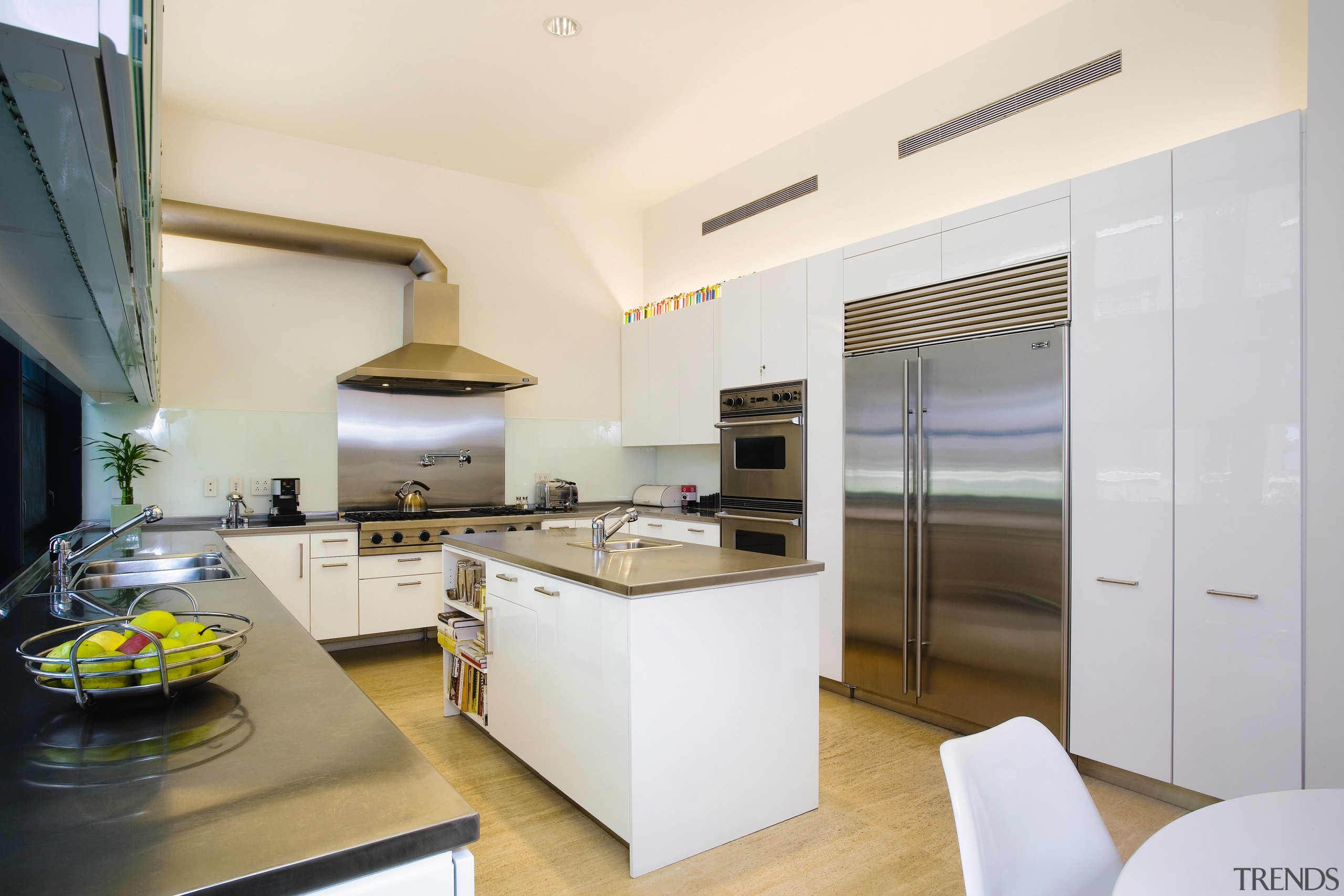 view of this kitchen featuring  travertie flooring, countertop, interior design, kitchen, real estate, white