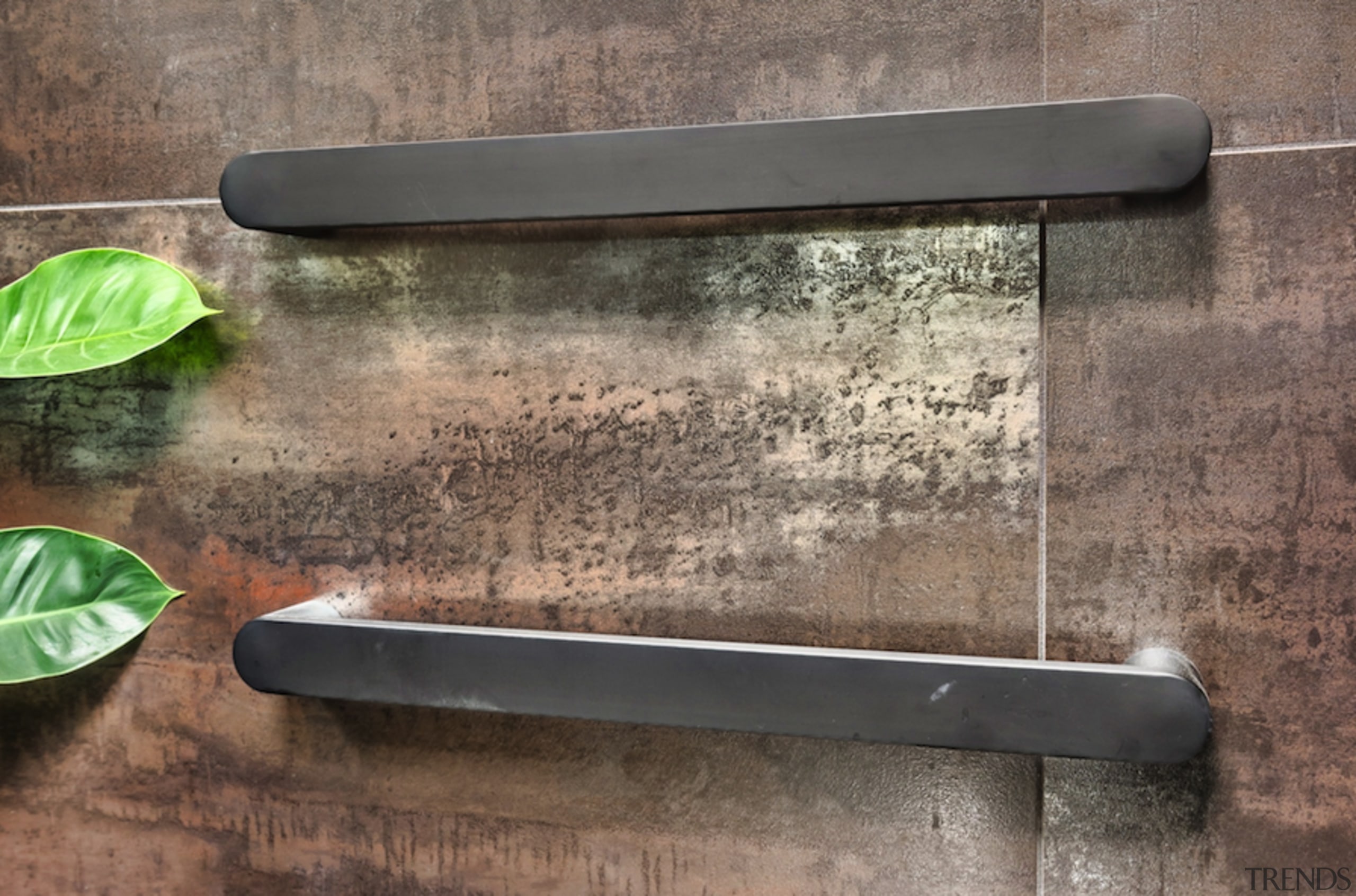 Brushed steel towel rails work well with the 