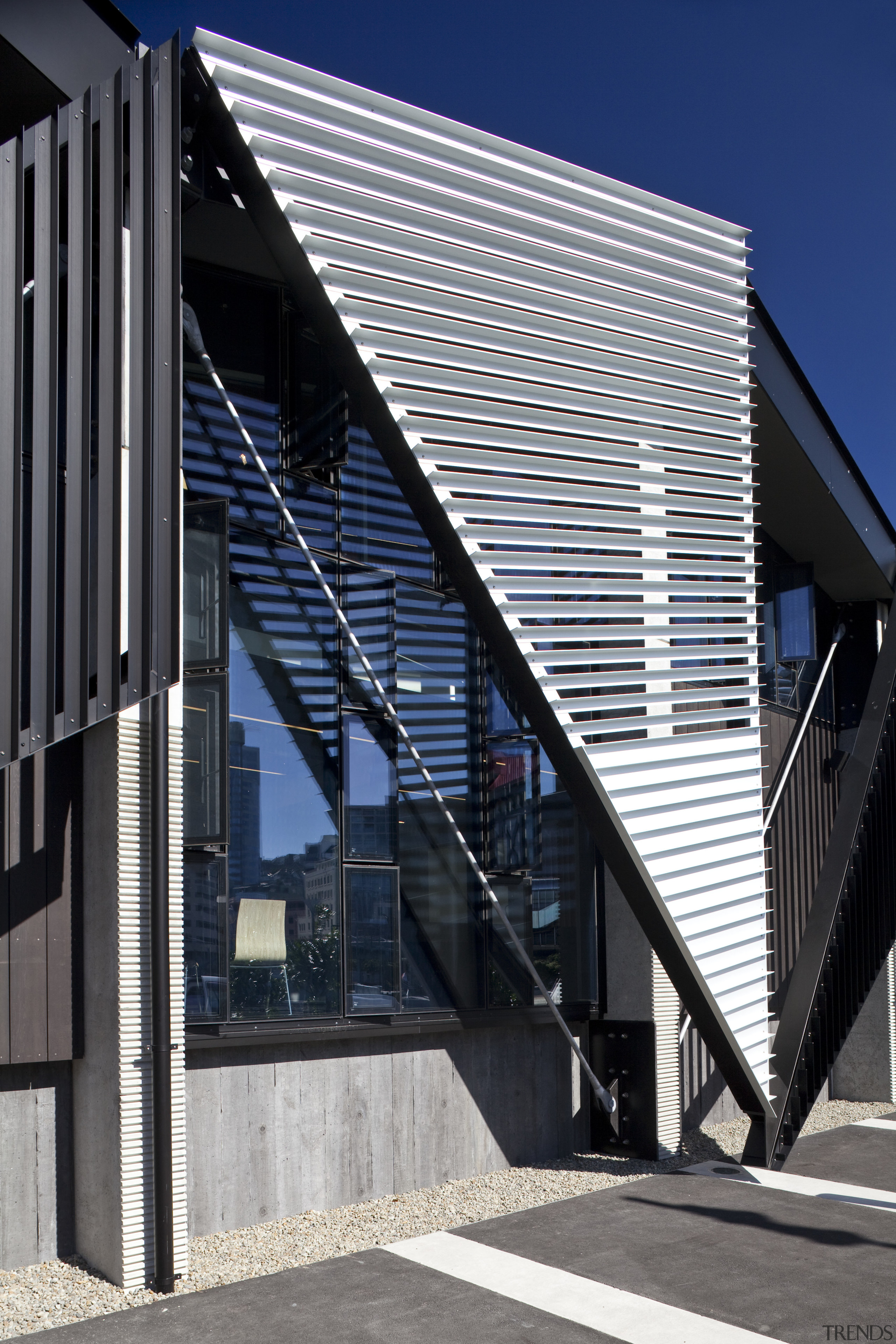 View of folded roof and canopy design at architecture, building, commercial building, corporate headquarters, daylighting, daytime, facade, house, line, neighbourhood, residential area, structure, window, black, gray