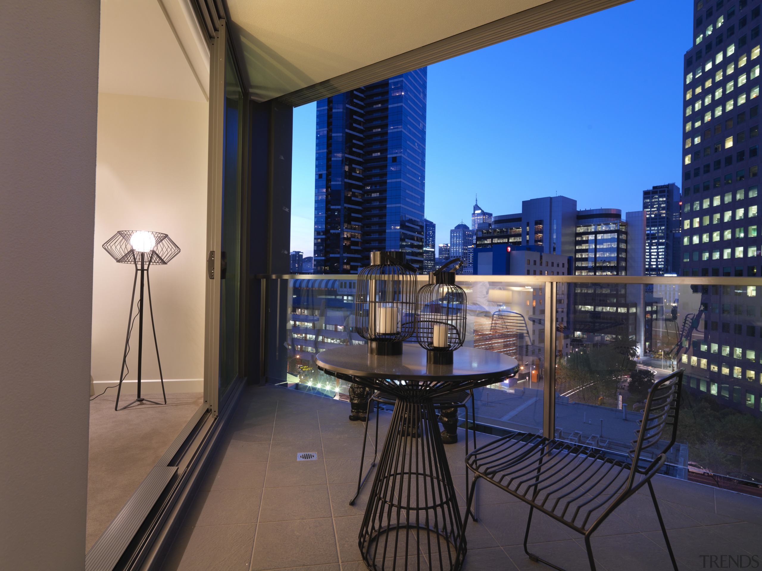 View of the deck of an apartment at apartment, architecture, building, city, condominium, home, property, real estate, sky, window