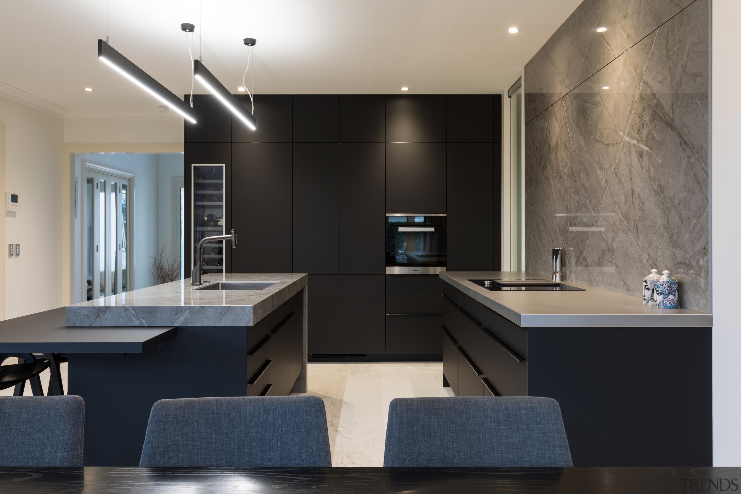 The full-height cabinetry and bar top surfaces are 
