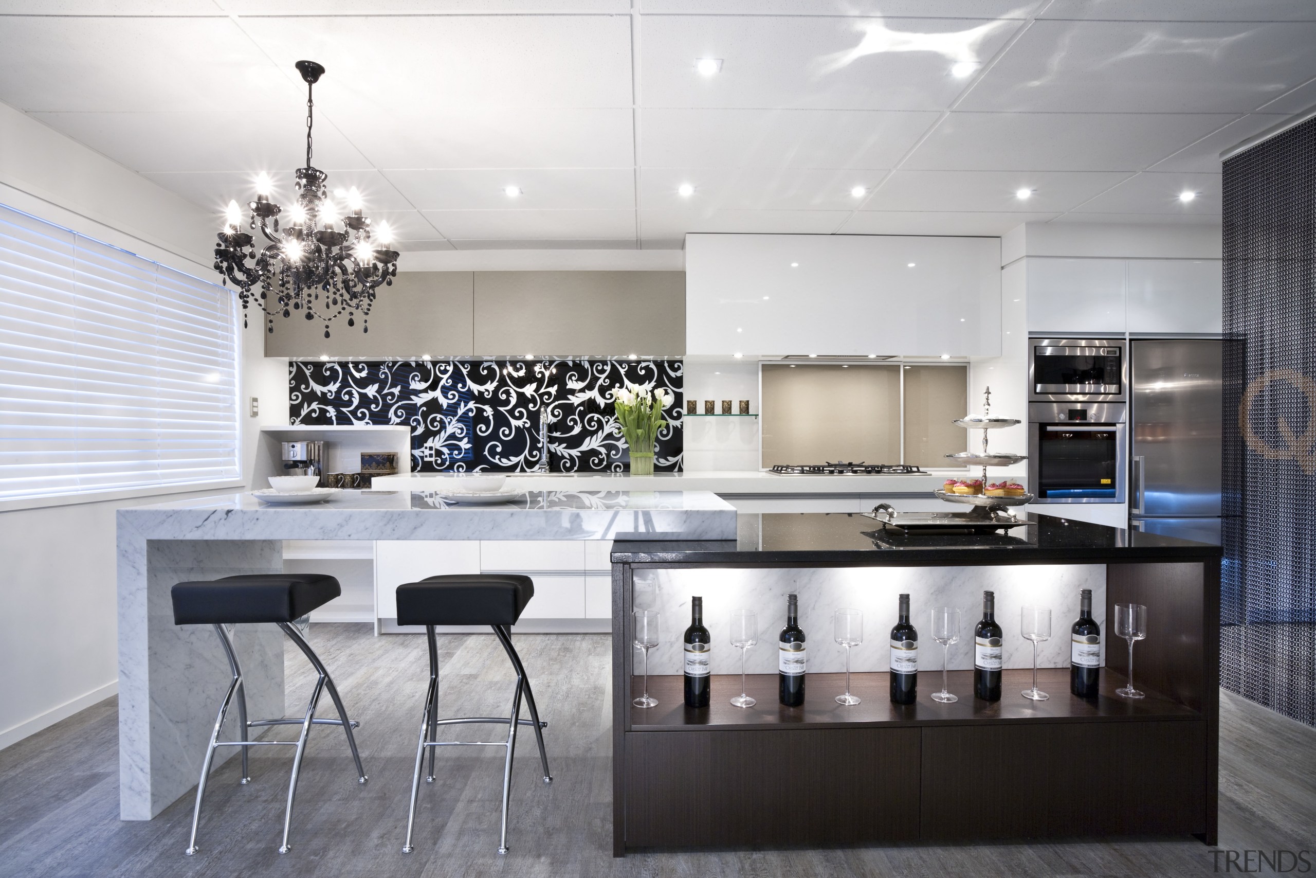 This kitchen by Yellowfox features an island with ceiling, countertop, interior design, interior designer, kitchen, gray, white