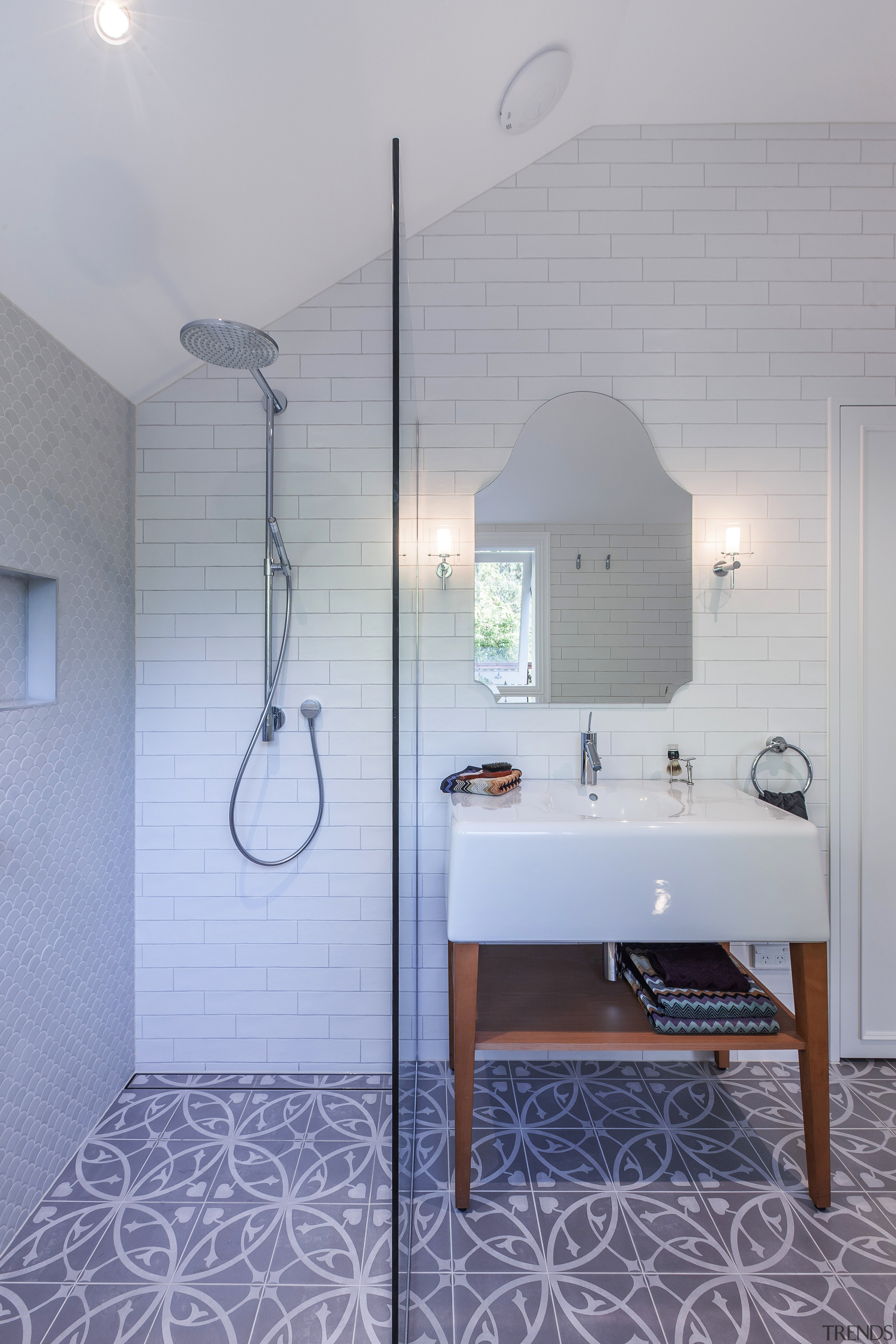 For this bathroom by designer Natalie Du Bois, architecture, bathroom, ceiling, daylighting, floor, flooring, home, house, interior design, light fixture, lighting, plumbing fixture, product design, room, sink, tap, tile, wall, gray