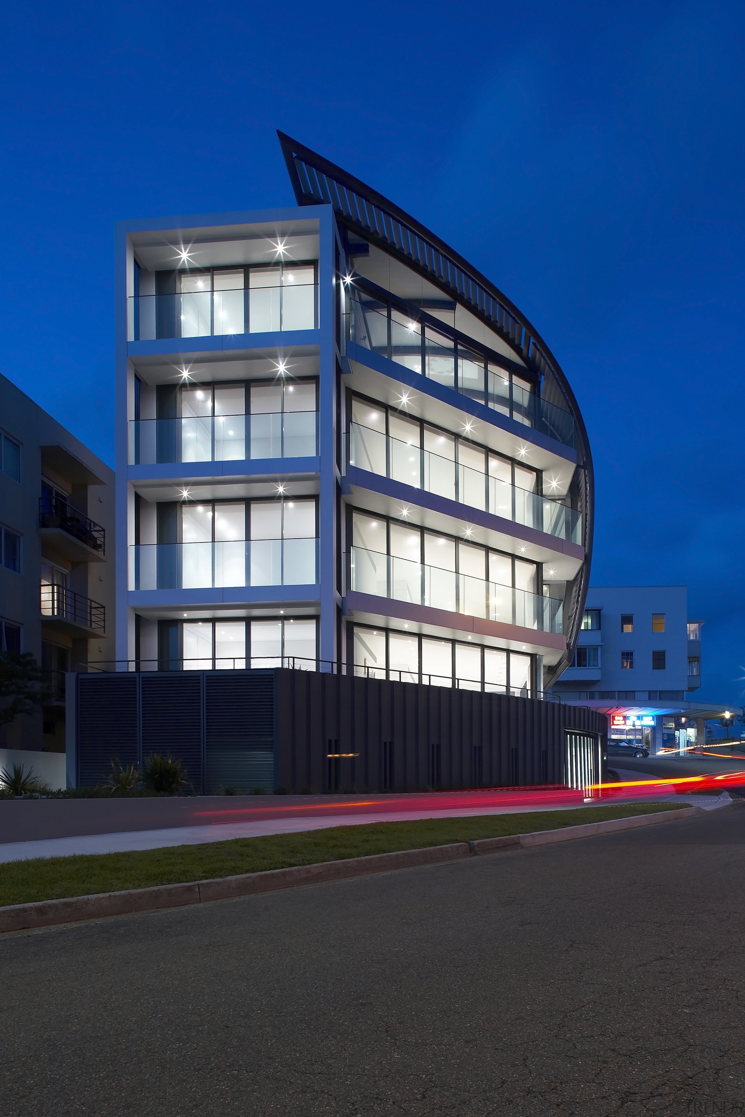 Exterior view of a Sydney apartment building which apartment, architecture, building, commercial building, condominium, corporate headquarters, daytime, facade, headquarters, home, house, landmark, metropolis, metropolitan area, mixed use, real estate, residential area, sky, structure, blue, black